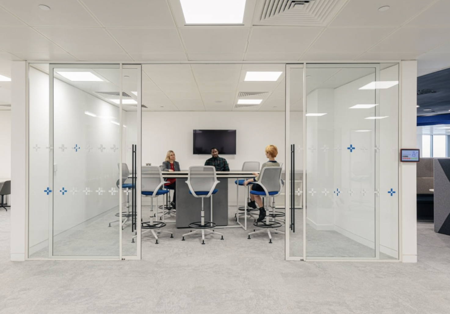 Modern glass meeting room at Datatonic, perfect for collaboration and presentations.