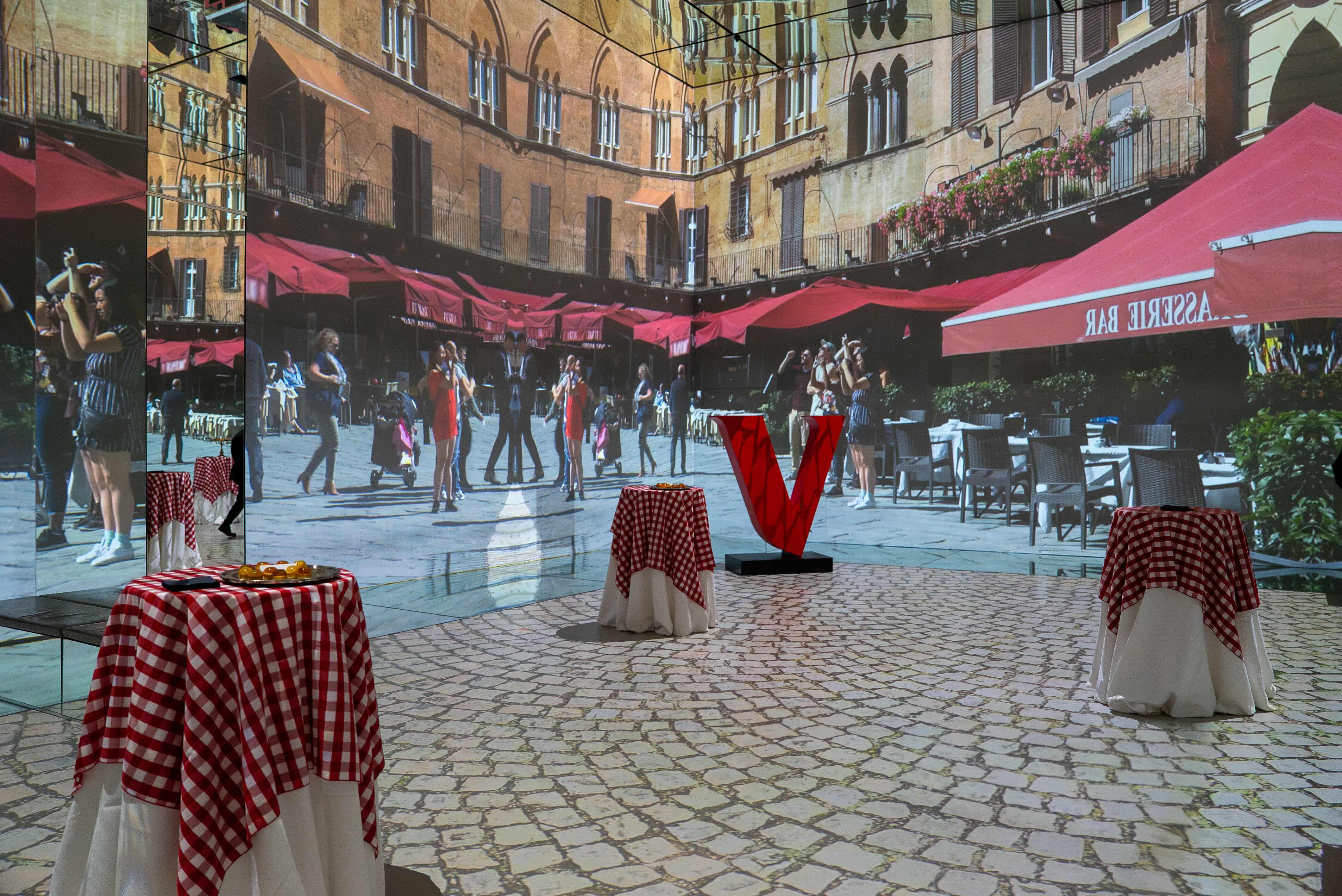 Dynamic event space with checkered tablecloths for themed gatherings and immersive experiences.