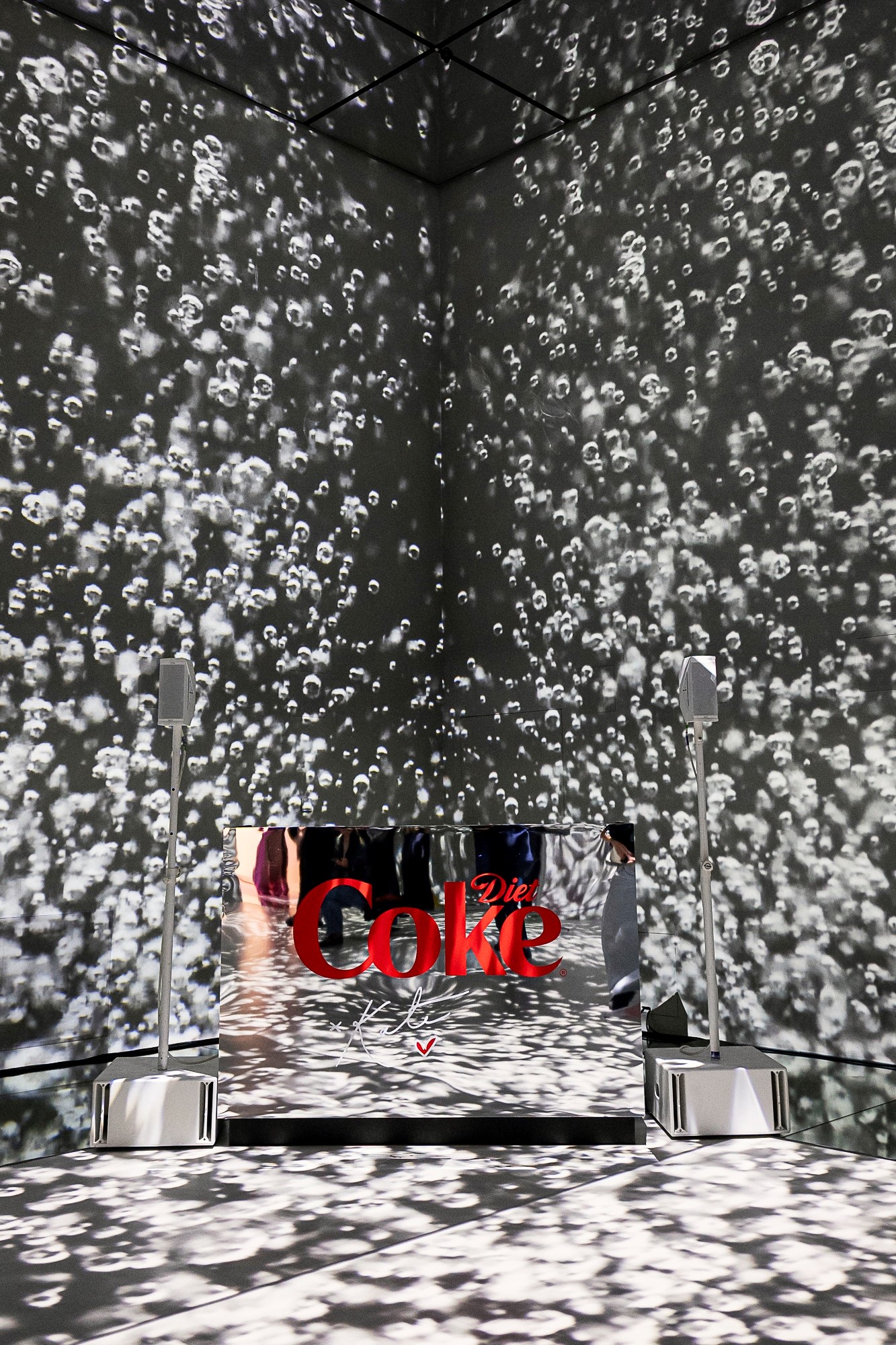 Immersive event space with dynamic projections for Coca-Cola product launches.