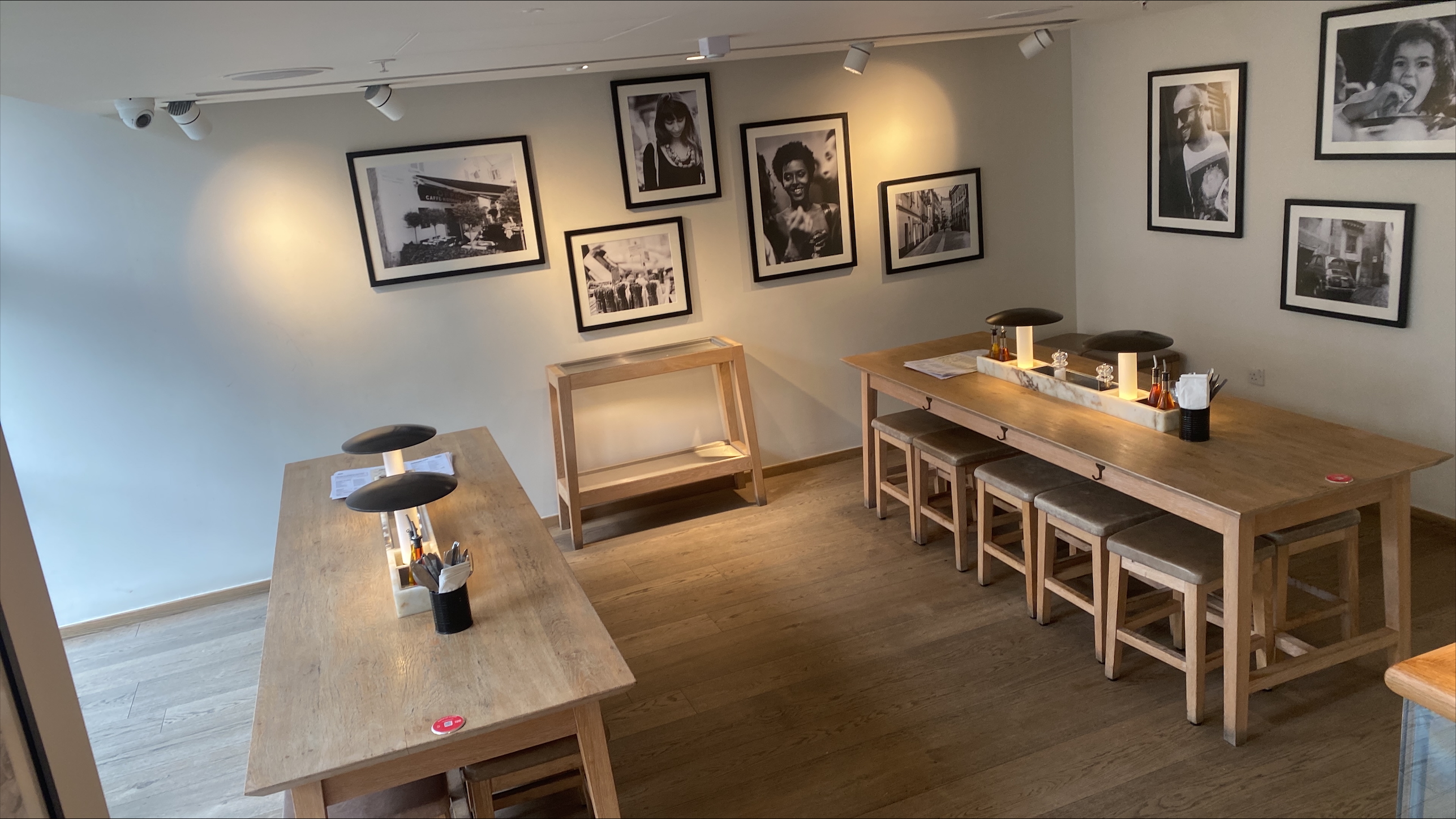 "Vapiano Manchester exclusive hire: cozy meeting space with wooden tables for workshops"