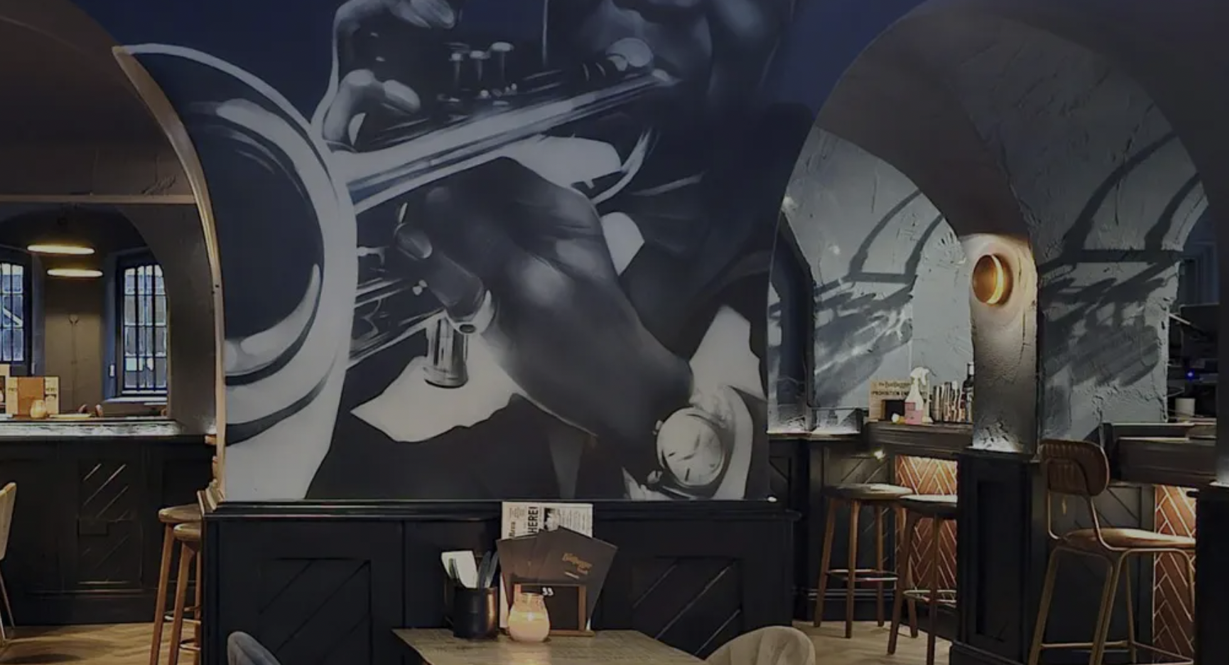 Jazz-themed mural at The Manor of Hurst venue for networking reception and VIP event hire.