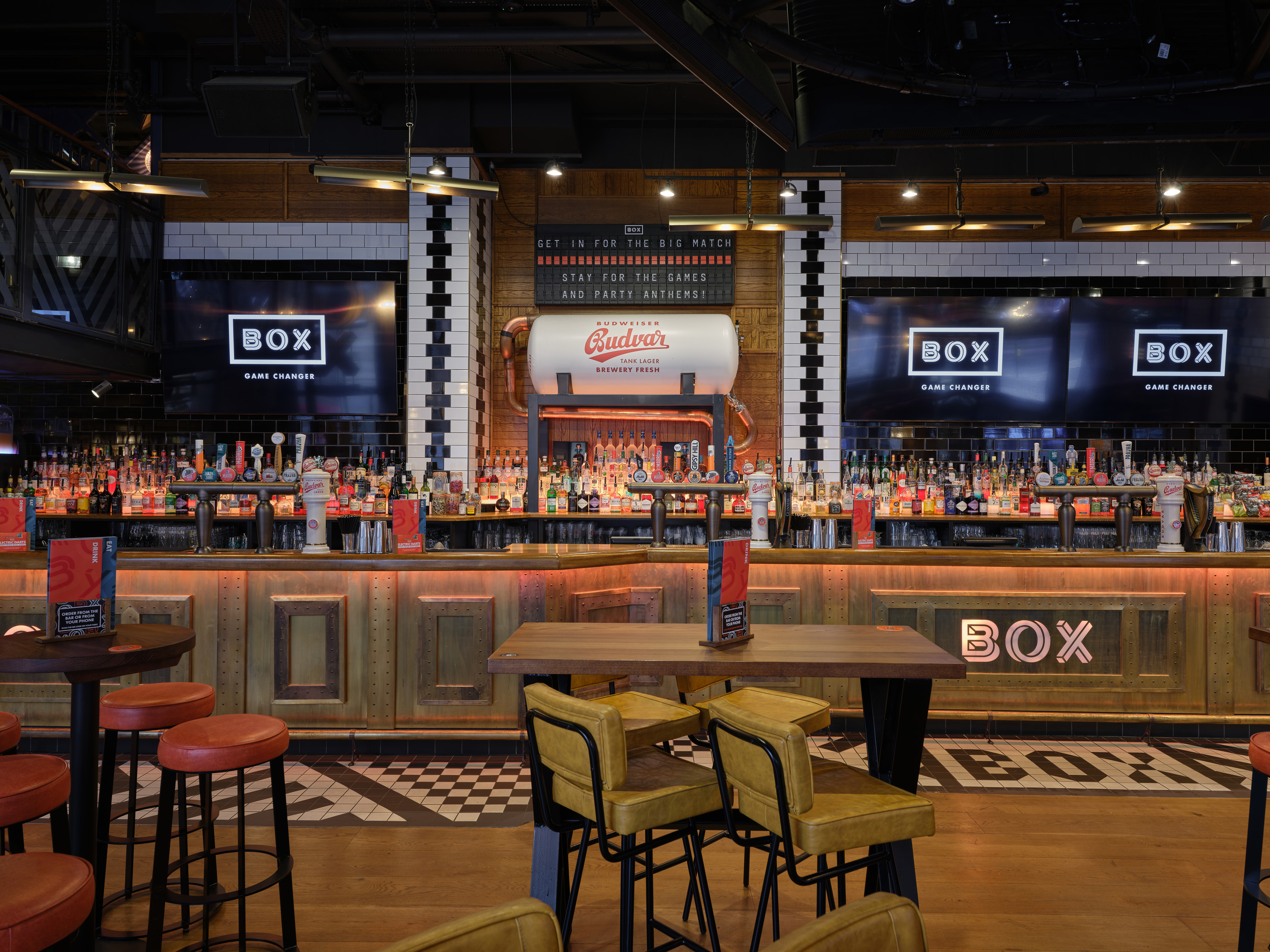 Vibrant bar area at BOX Piccadilly for networking events and casual meet-ups.