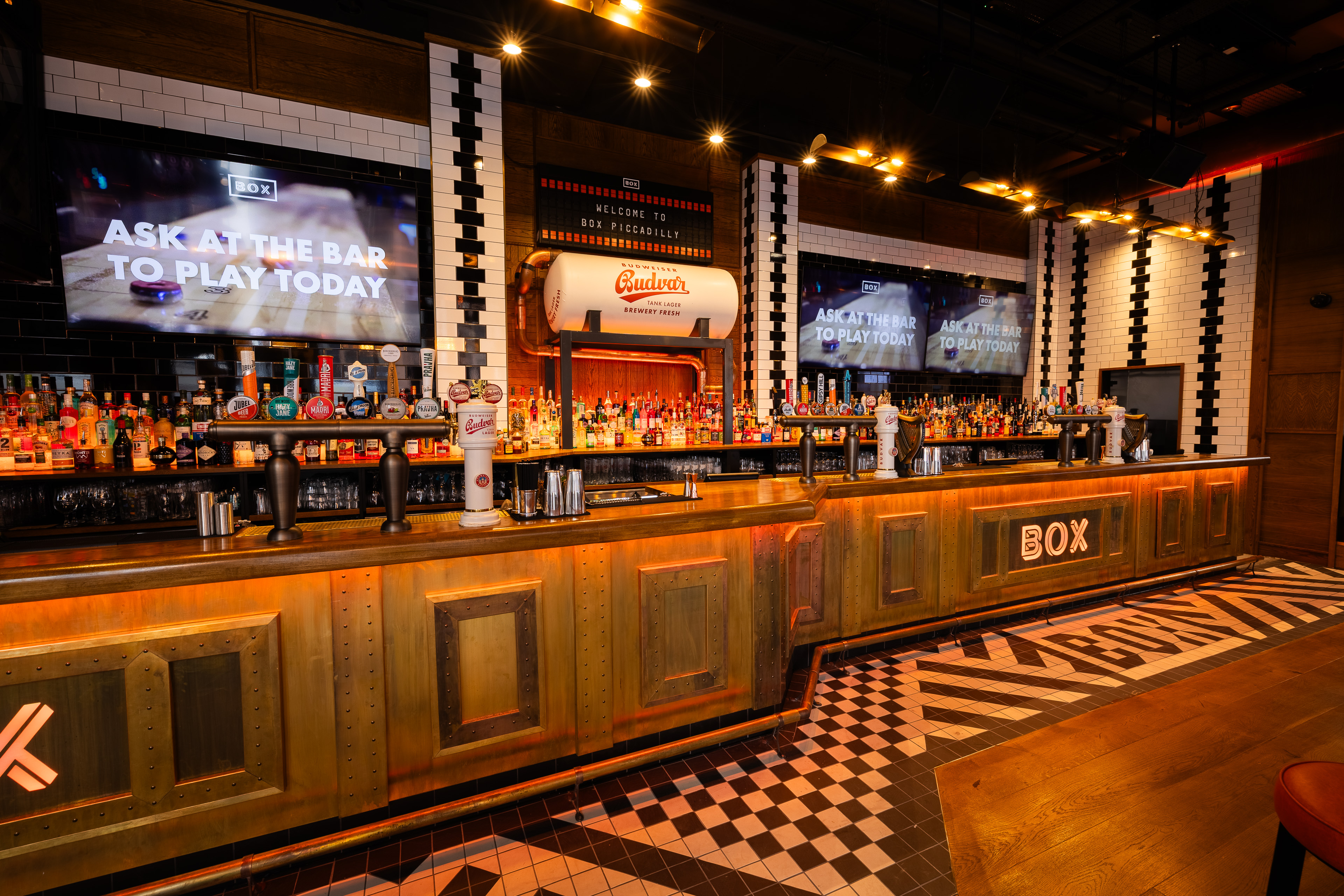 Vibrant BOX Piccadilly bar, rustic modern design for networking events and gatherings.