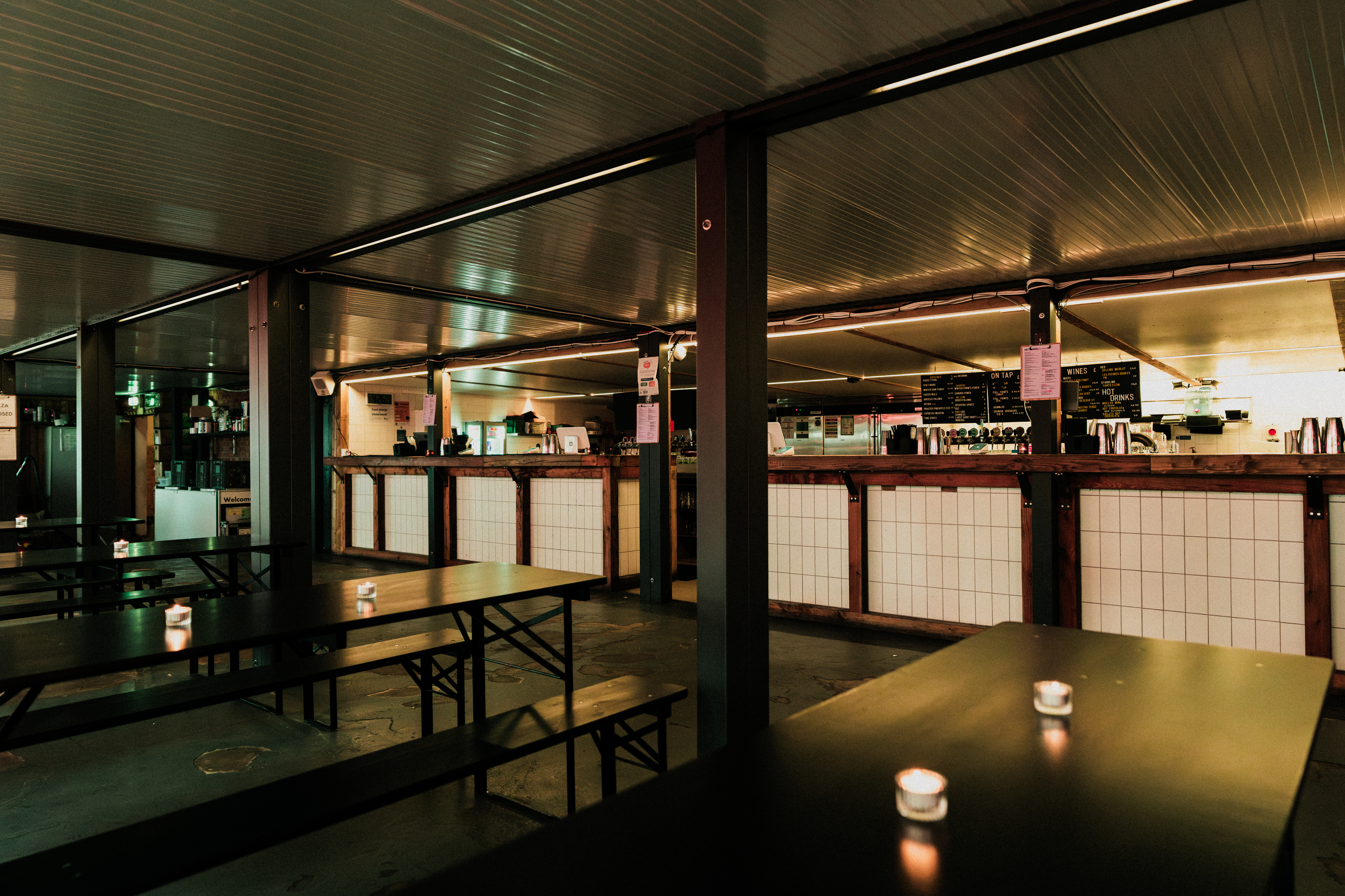 Netil360 Rooftop Main Room: industrial event space with long tables for networking gatherings.