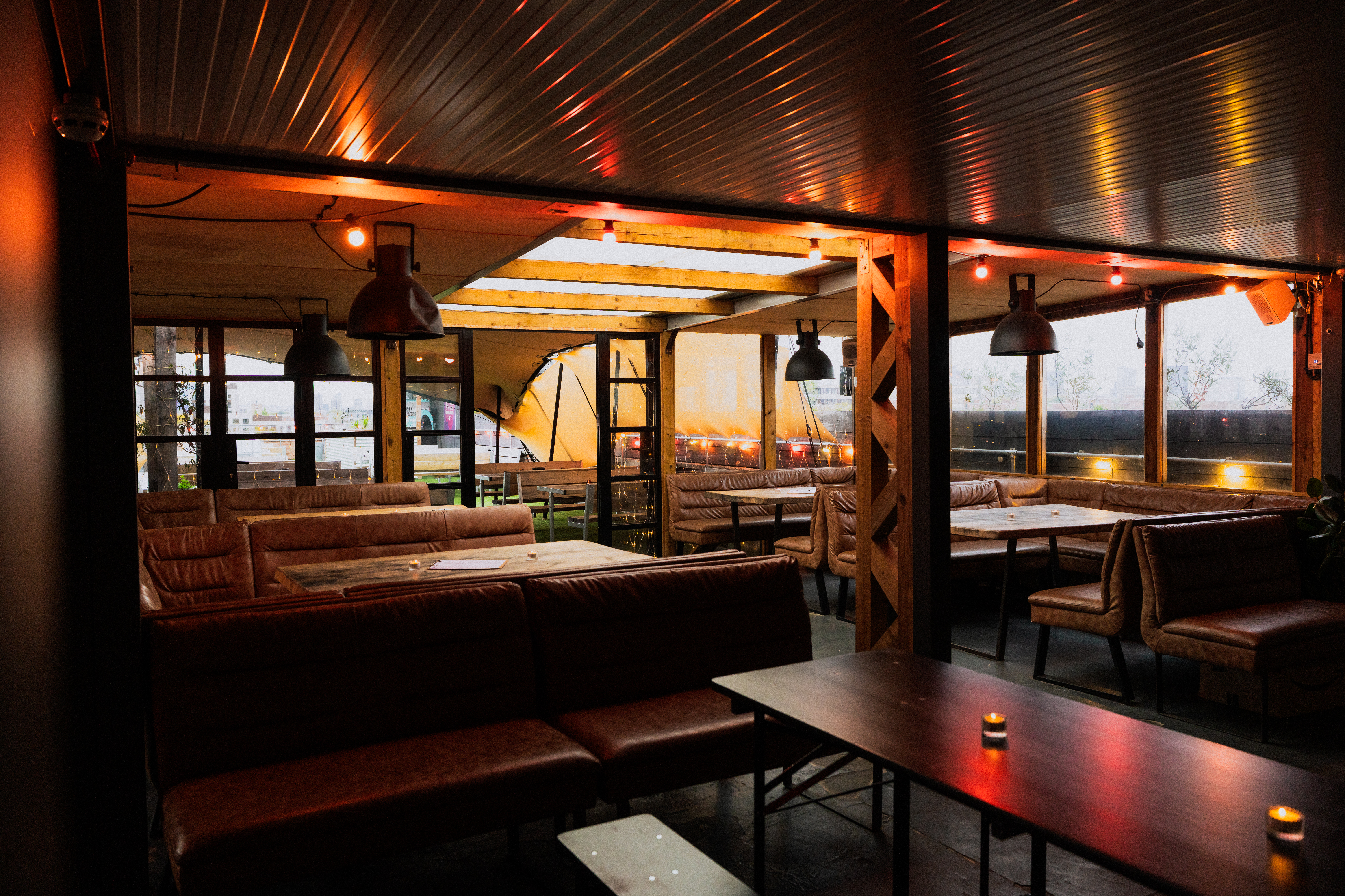 Stylish Netil360 Rooftop venue with cozy seating for corporate events and gatherings.