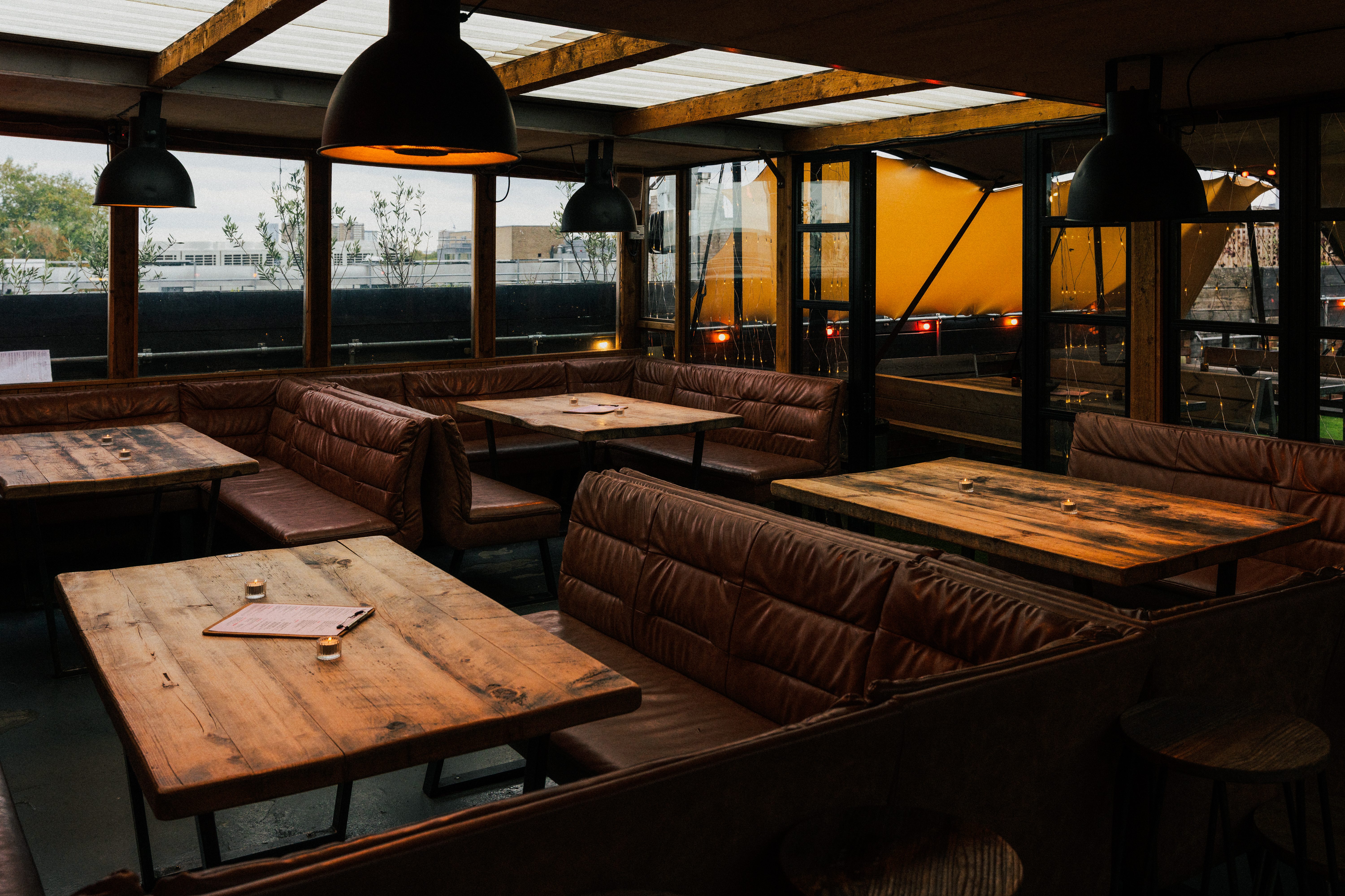 Cozy Netil360 Rooftop Main Room for intimate meetings and casual gatherings.