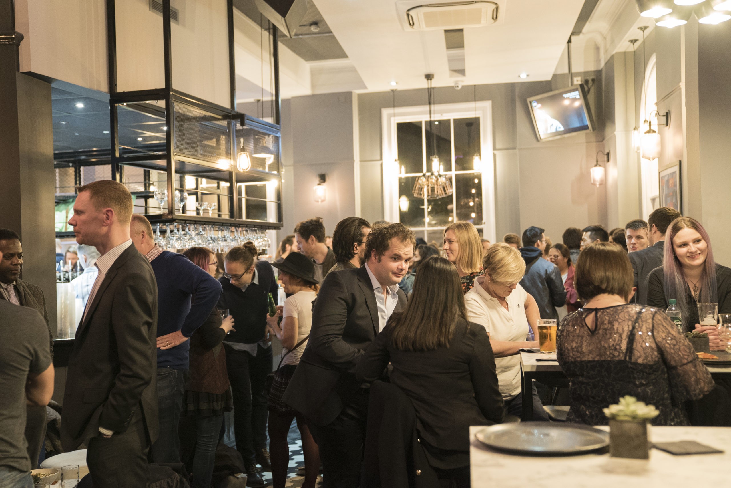 Vibrant Thirsty Scholar venue with warm lighting, ideal for networking events.