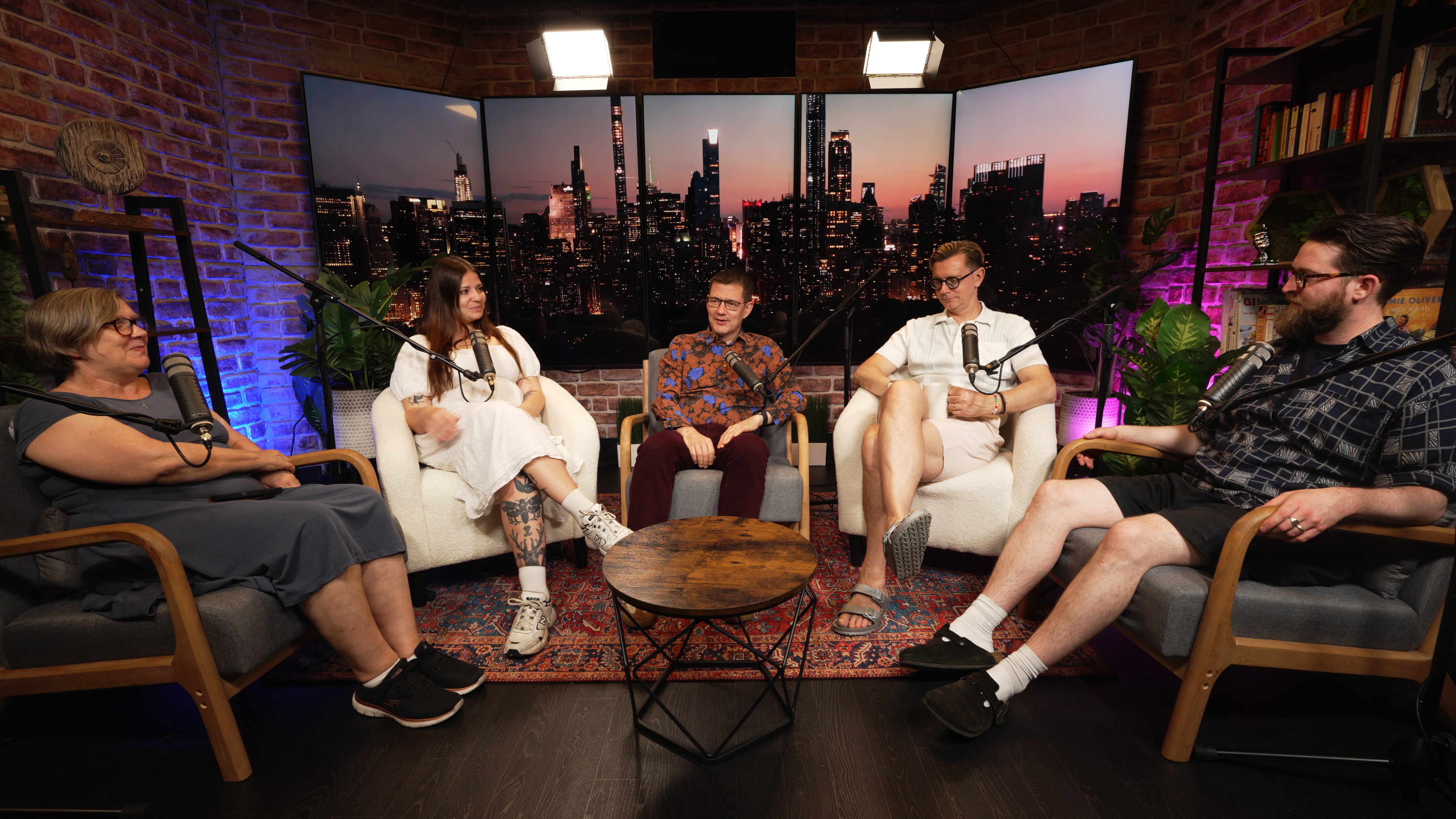 "Broadcast podcast studio setup with city skyline for engaging panel discussions."