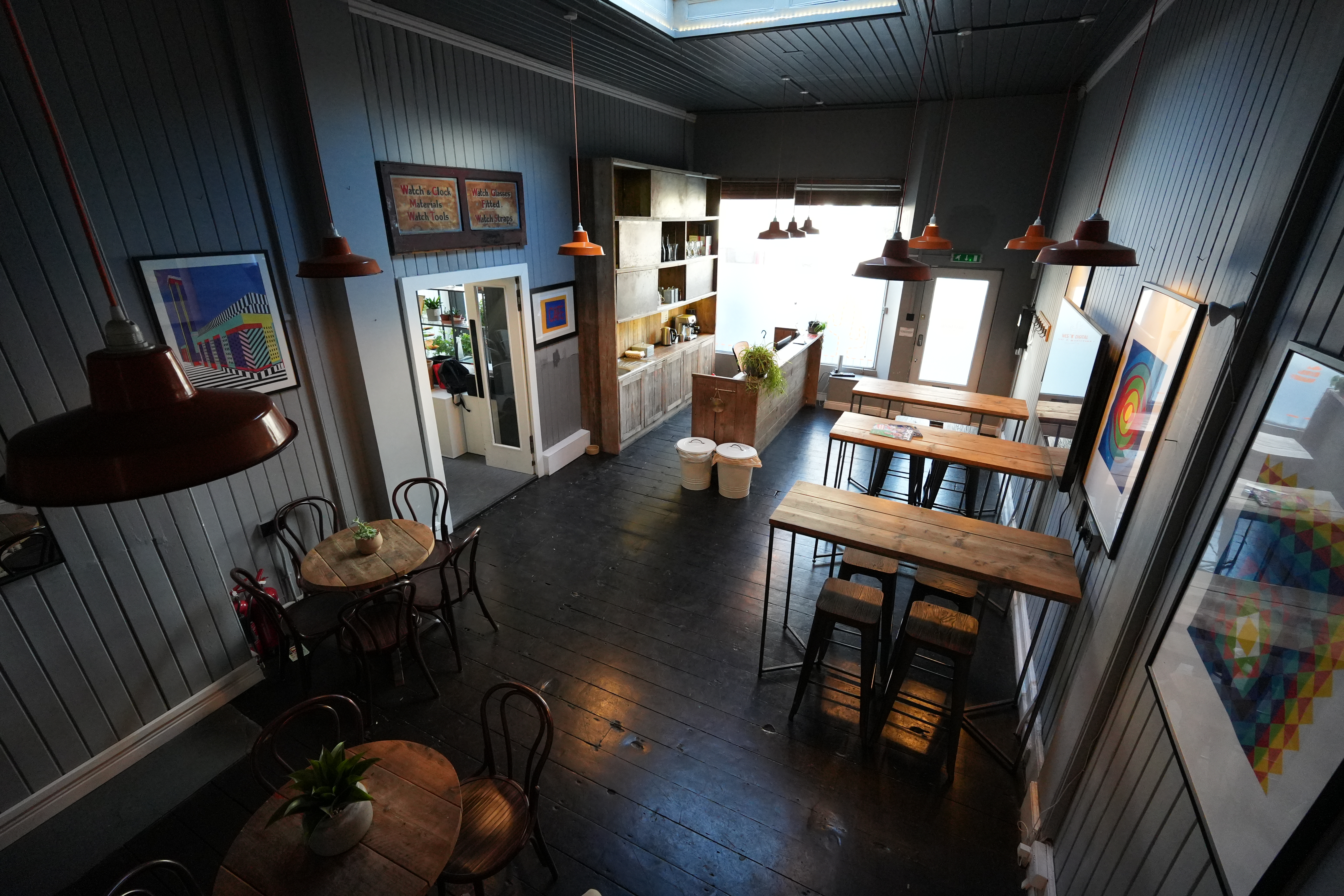 Intimate bar and event space with rustic decor for gatherings and meetings in West Digital Studios.