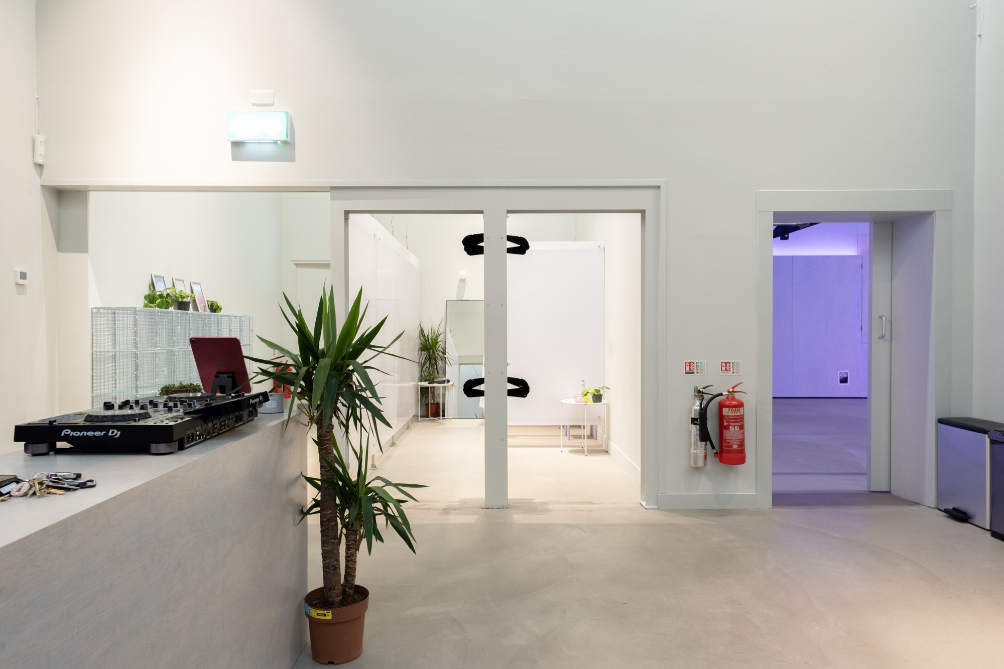 Modern Rogue Room event space with DJ console for corporate receptions and product launches.