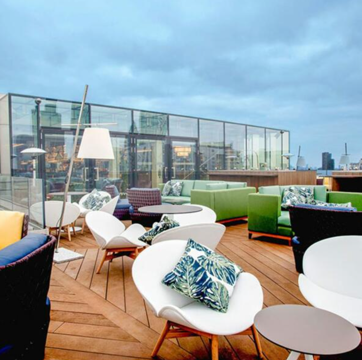 Chic rooftop meeting space with city views for networking events in London.