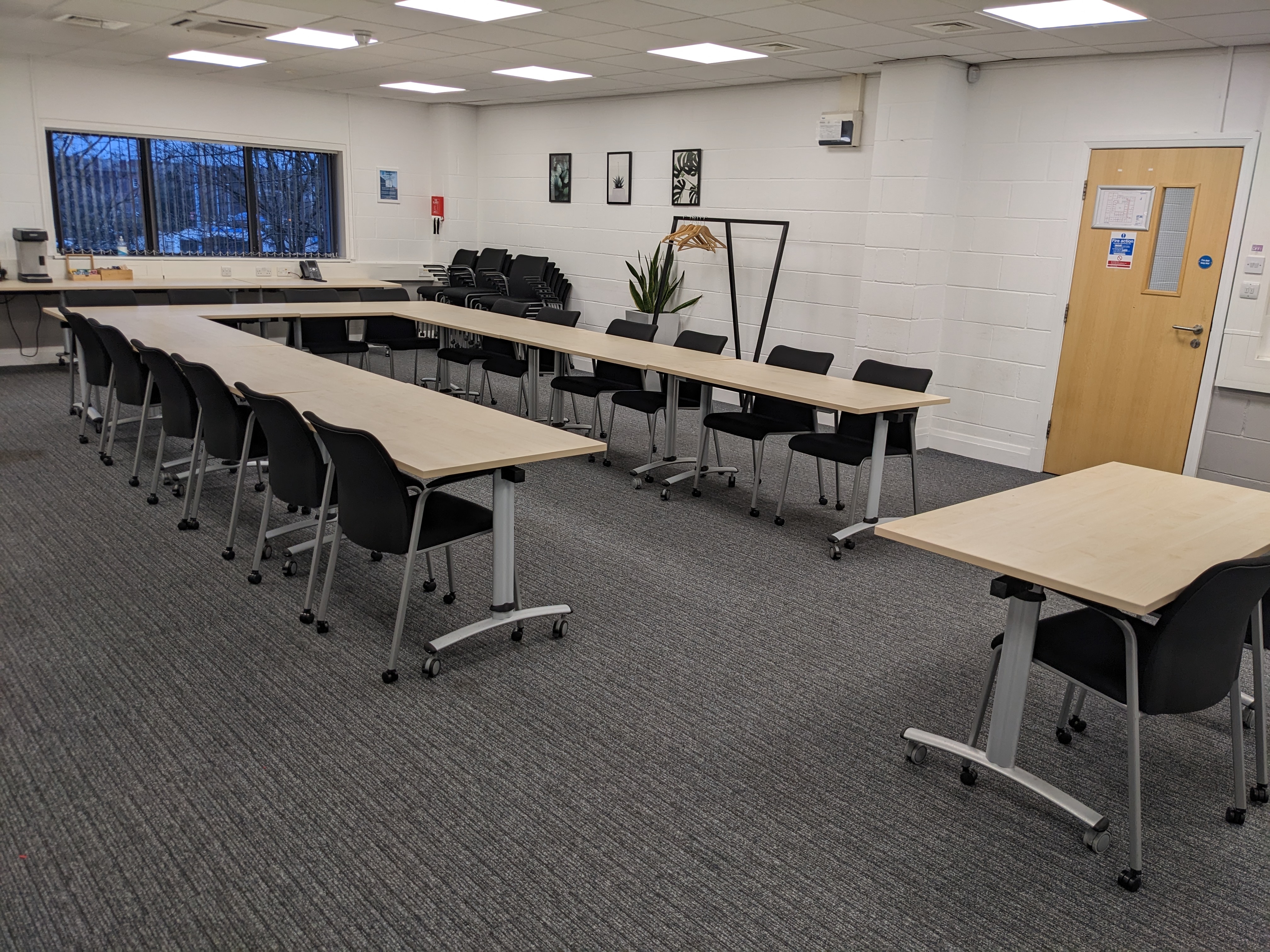 "Europa House Conference Room with flexible tables for workshops and meetings in Bury."
