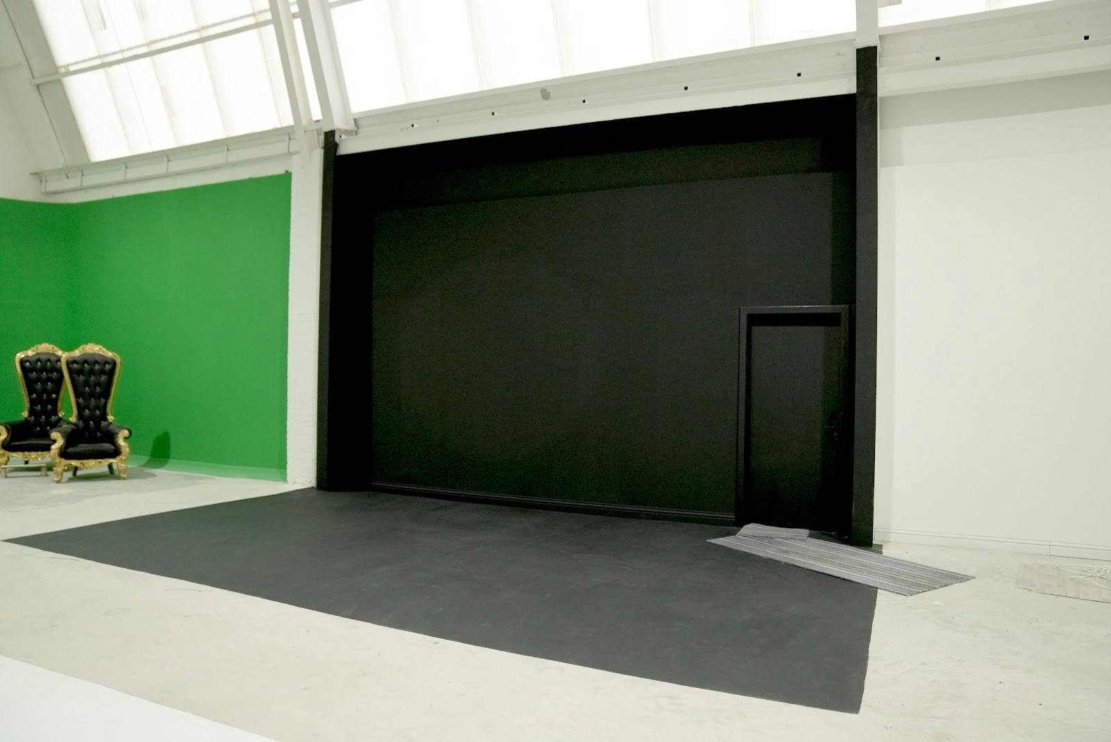Production studio with black stage backdrop, perfect for versatile events and presentations.