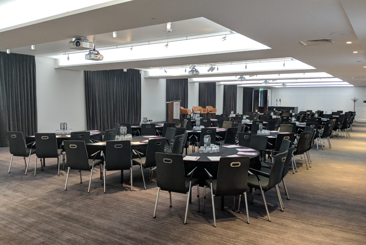 Waterloo Suite at etc.venues County Hall: versatile conference space with round tables.
