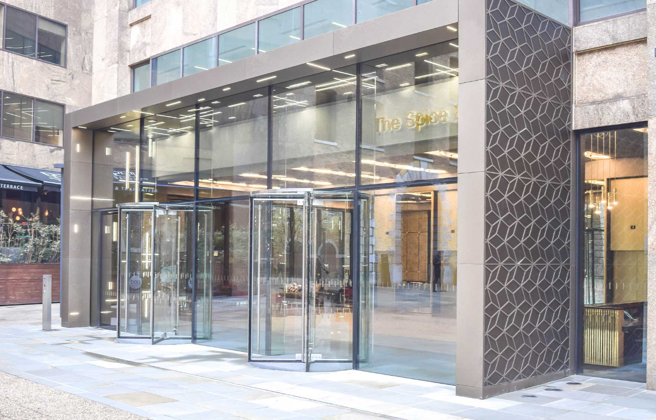 Modern Glasshouse entrance at Sir Devonshire Square for corporate events and meetings.
