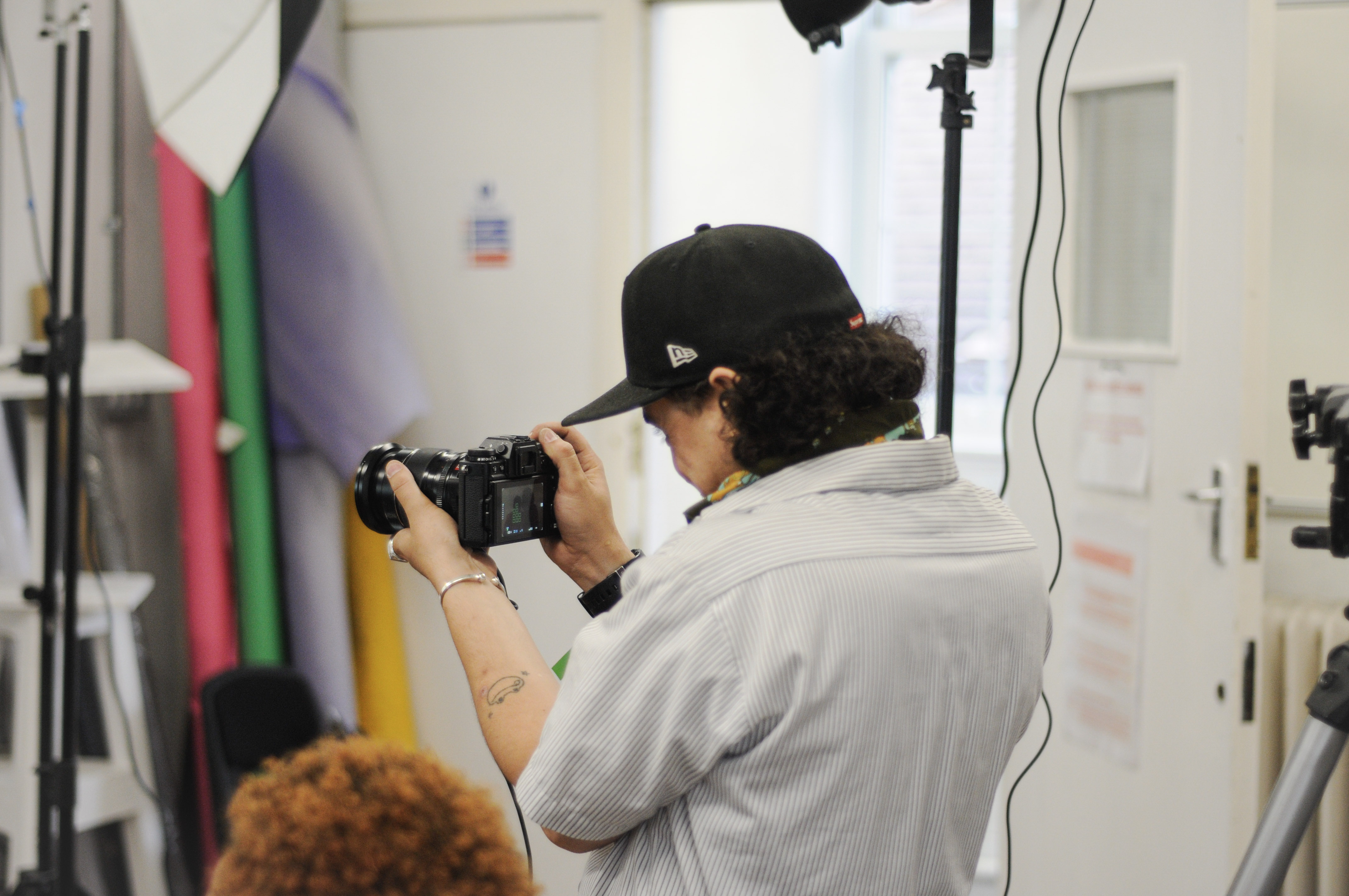Photographer in creative studio at Rosetta Arts Centre, enhancing event documentation.