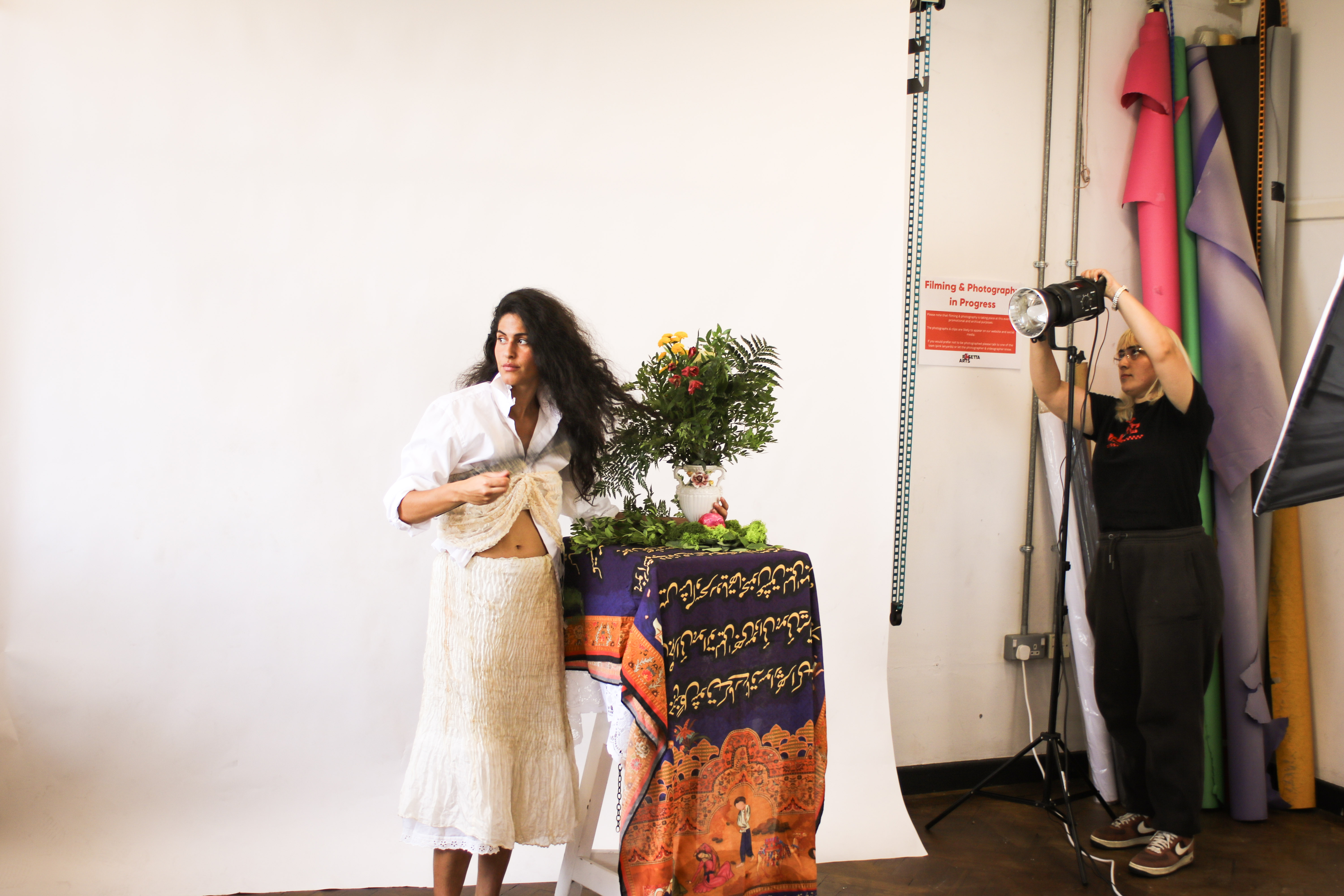 Model posing in vibrant photography studio at Rosetta Arts Centre for themed events.