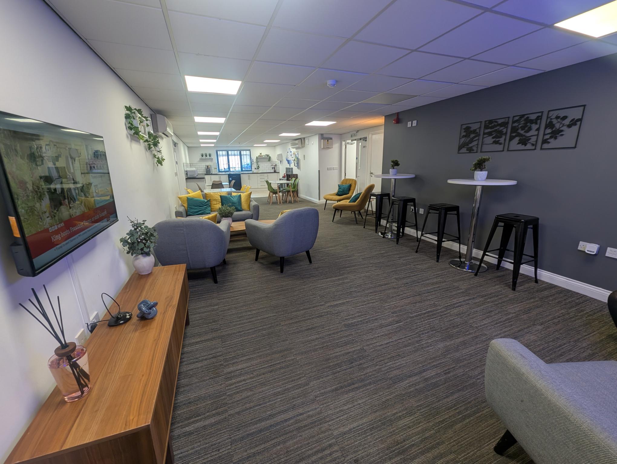 Modern meeting room at Bury Businesslodge for workshops and networking events.