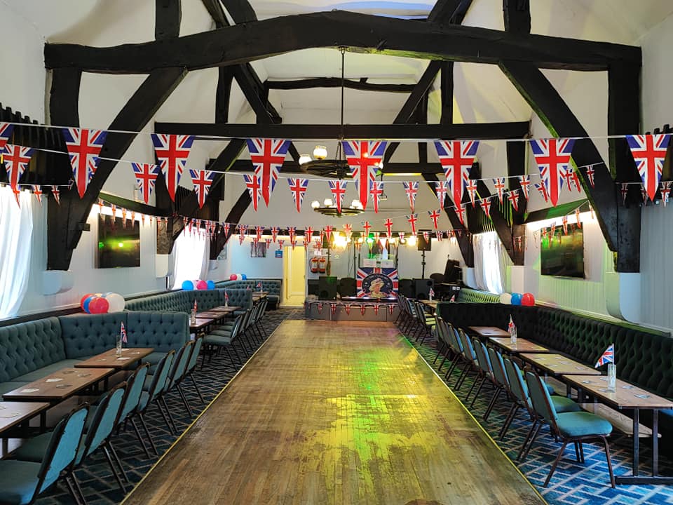 Tythe Barn event venue with wooden beams, perfect for British-themed parties and gatherings.