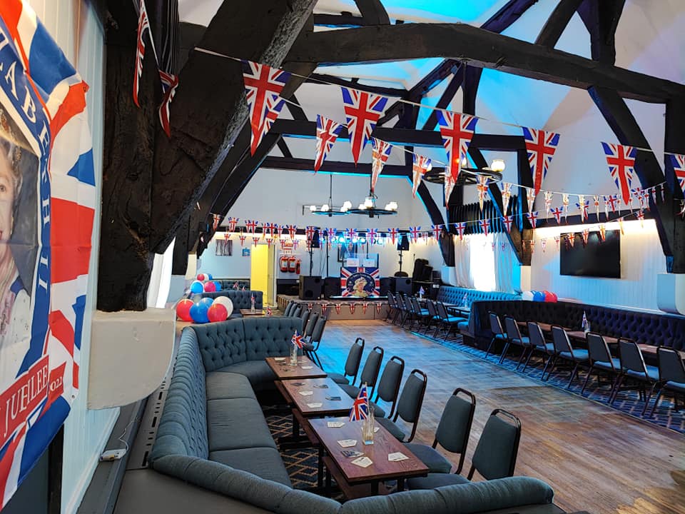 Tythe Barn event space with Union Jack decor for a British-themed party.