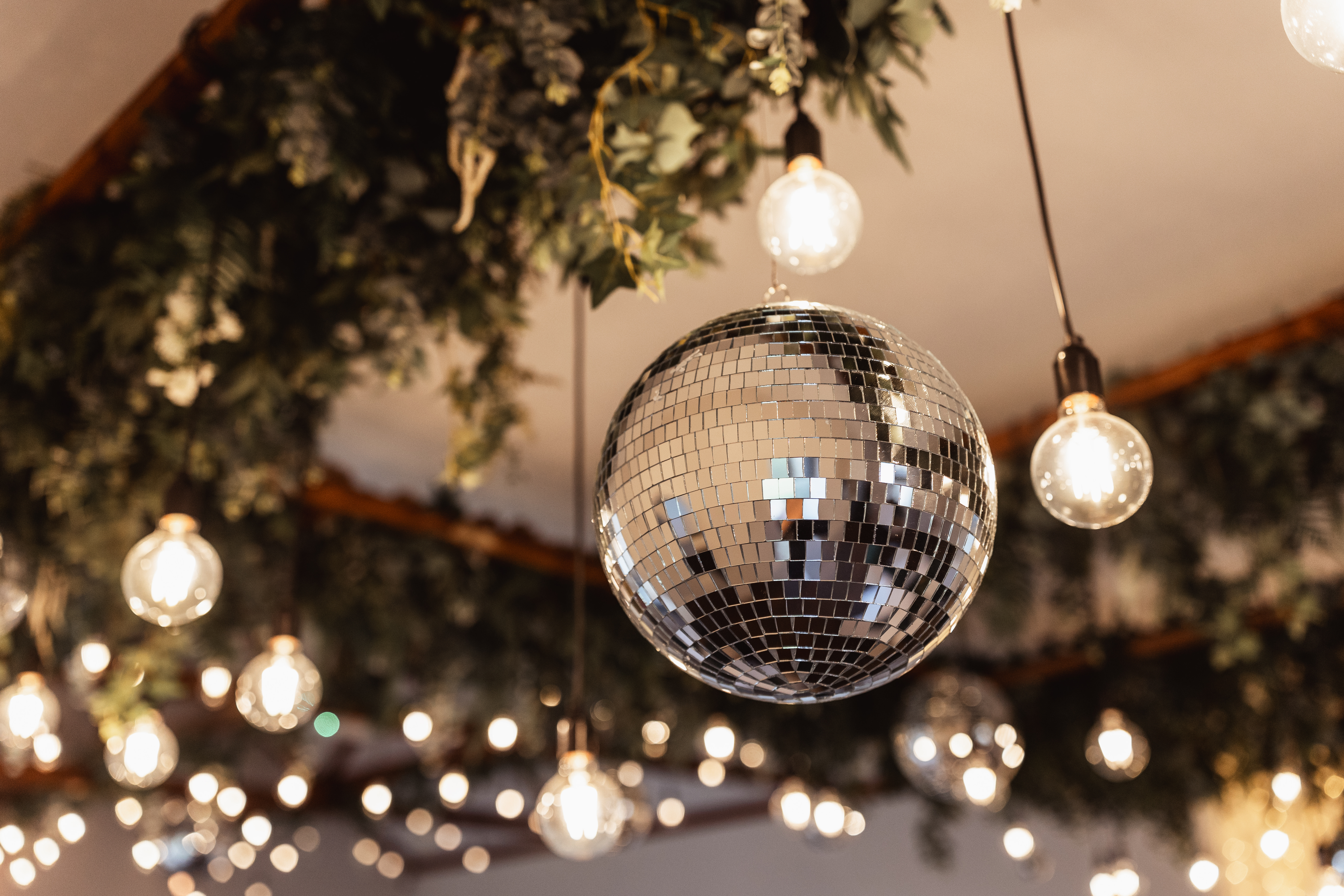 Ultimate Christmas Night venue with disco ball and warm lighting for festive events.
