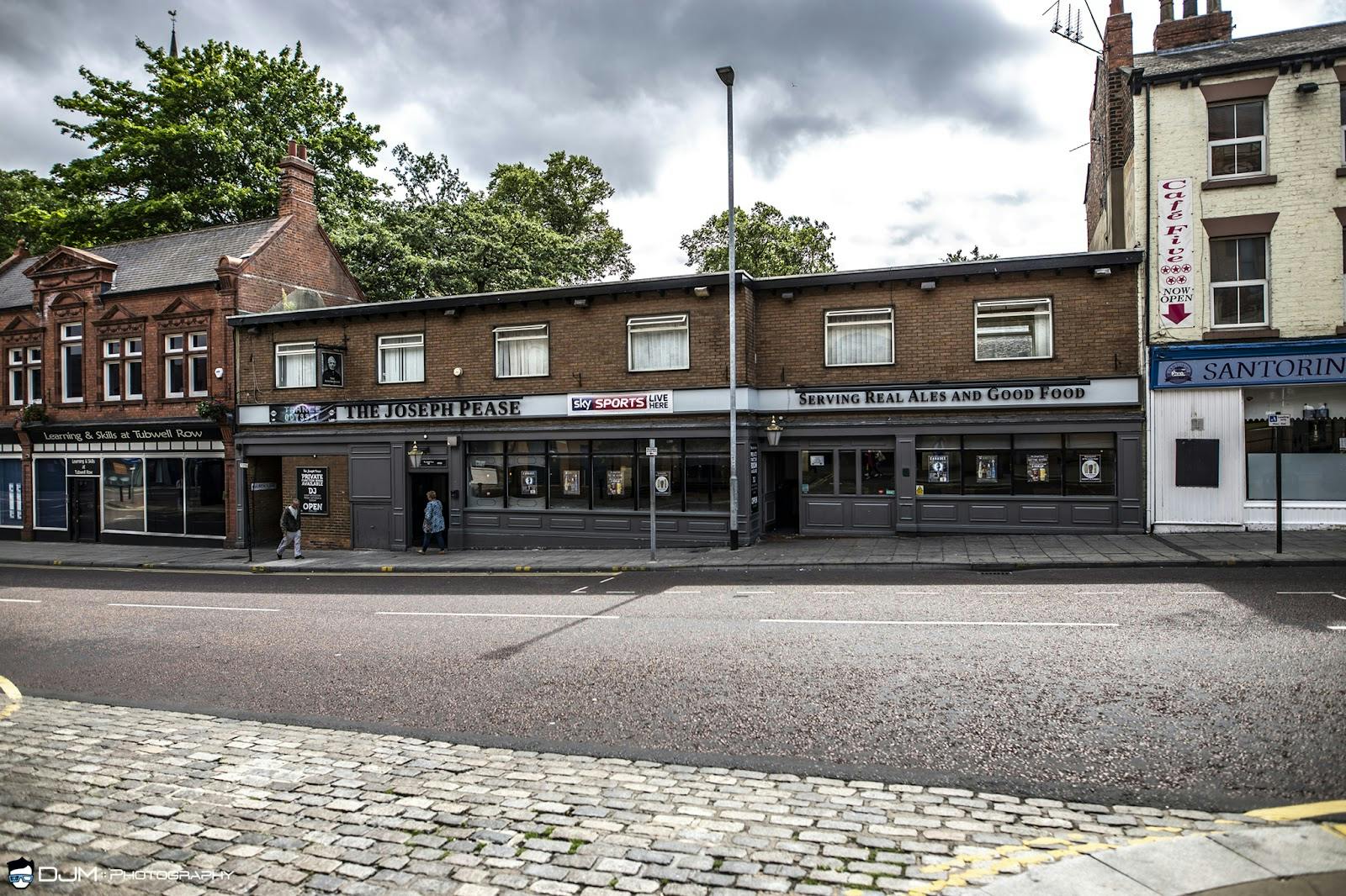 Bar at The Hoptimist with large windows, perfect for casual events and gatherings.