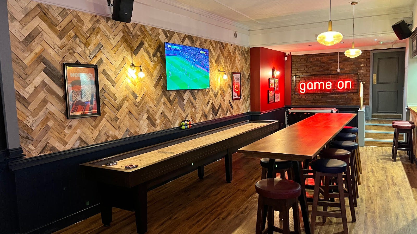 Stylish bar with wood accents for social events and sports viewing at The Hoptimist.