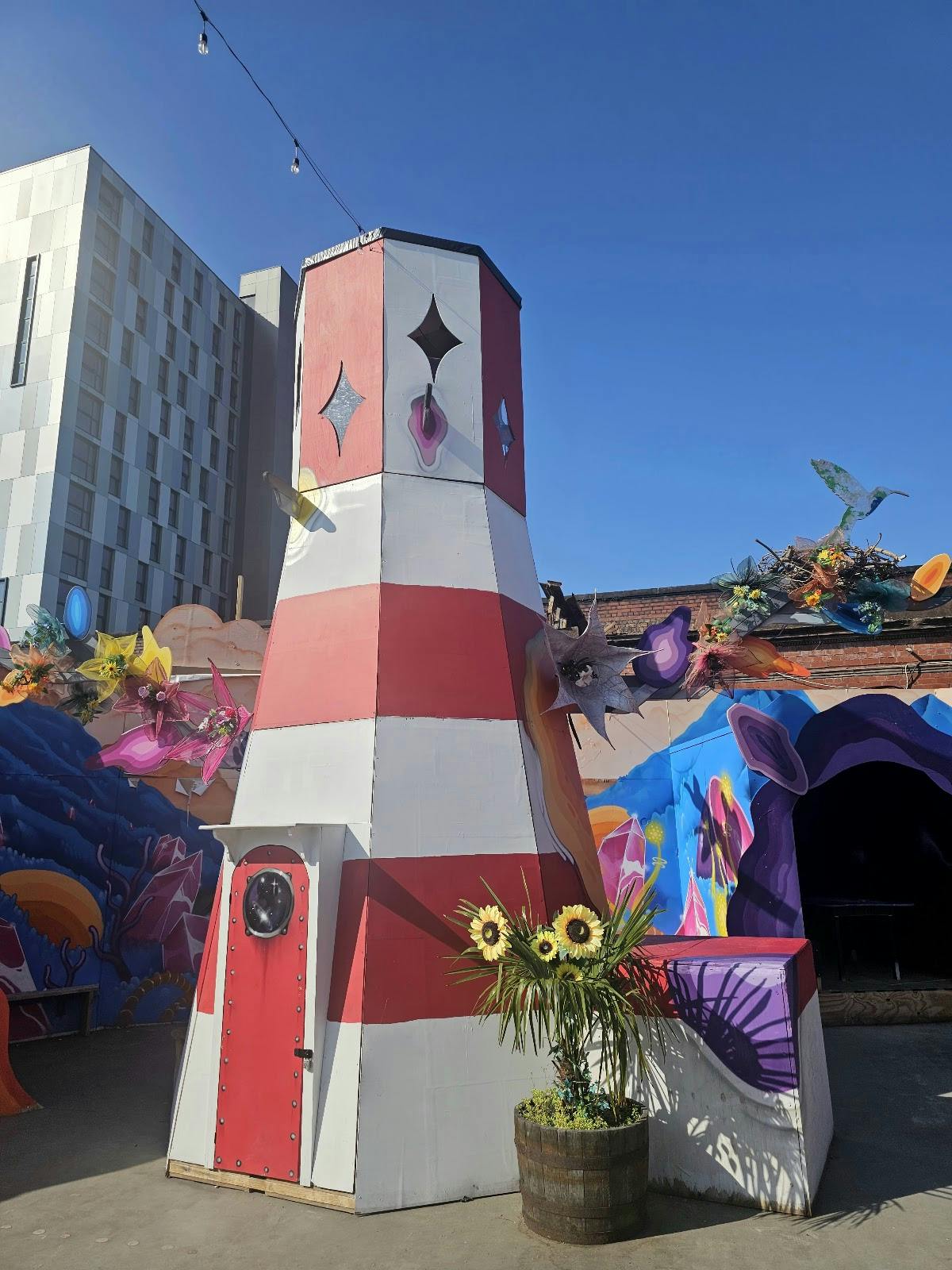 Rooftop bar with colorful lighthouse design for unique events and gatherings.