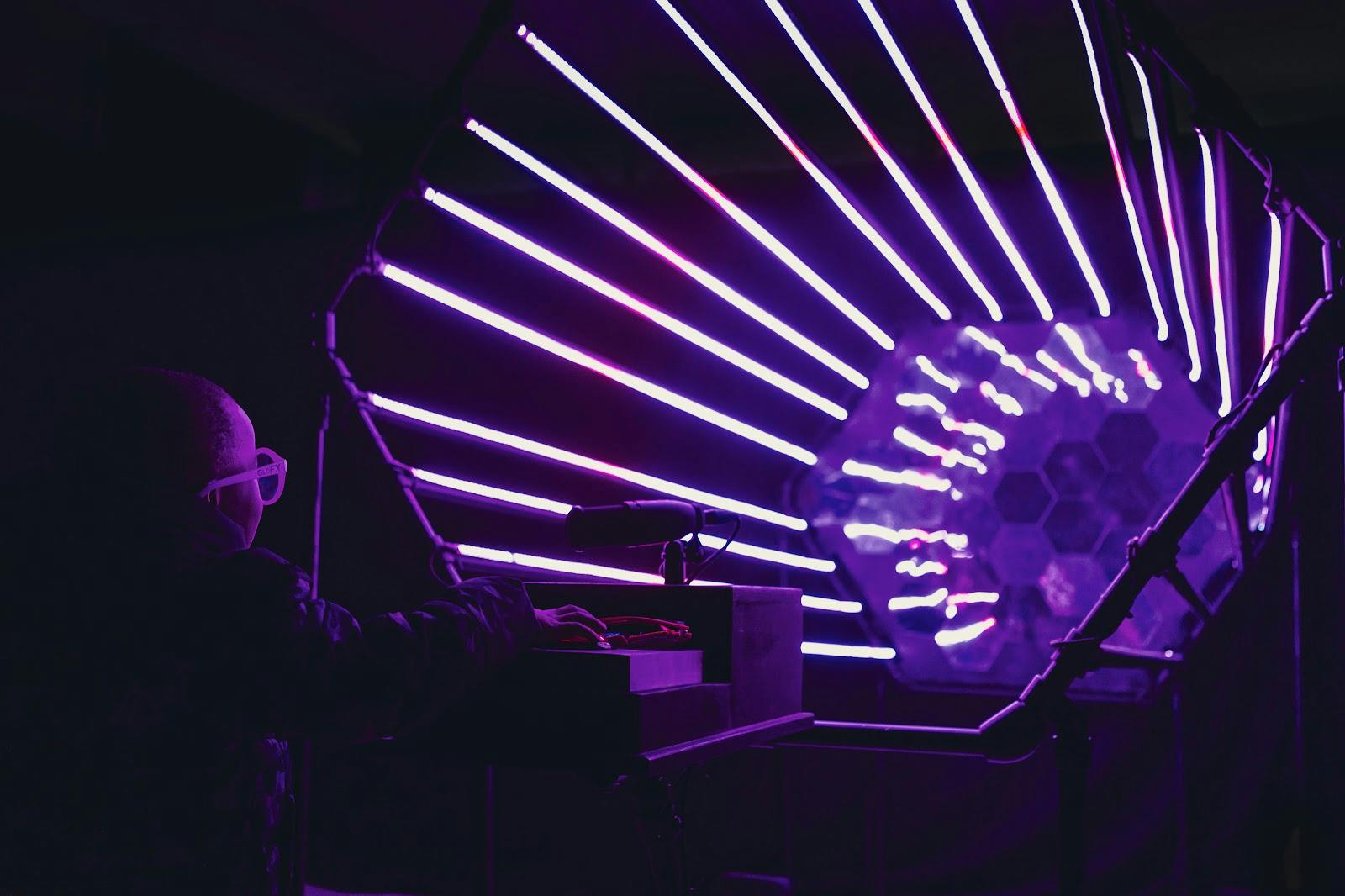 Rooftop bar at SUPERMASSIVE with neon lights for vibrant event ambiance.