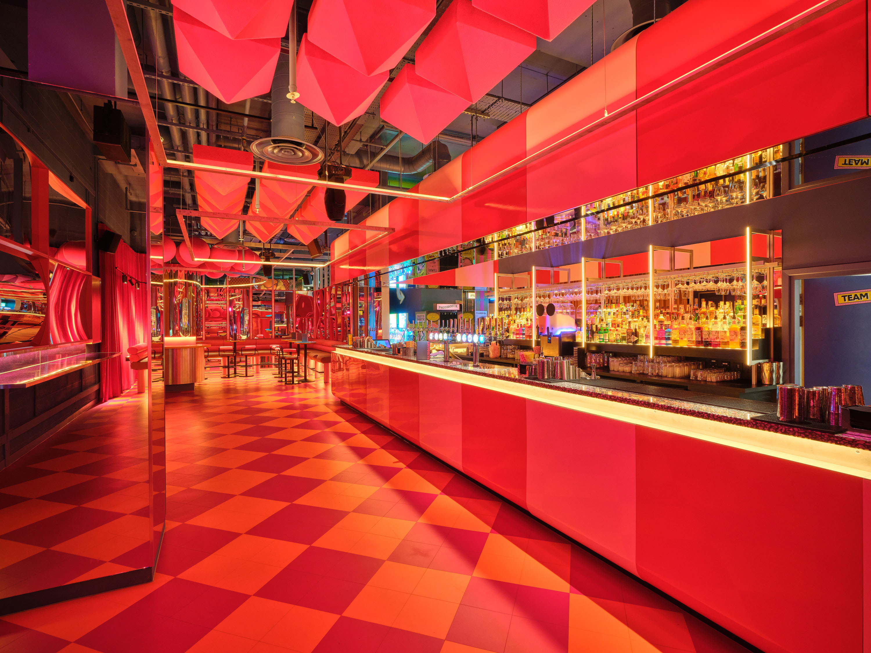 Vibrant 1/2 Fun House venue with dynamic colors for cocktail receptions or themed parties.