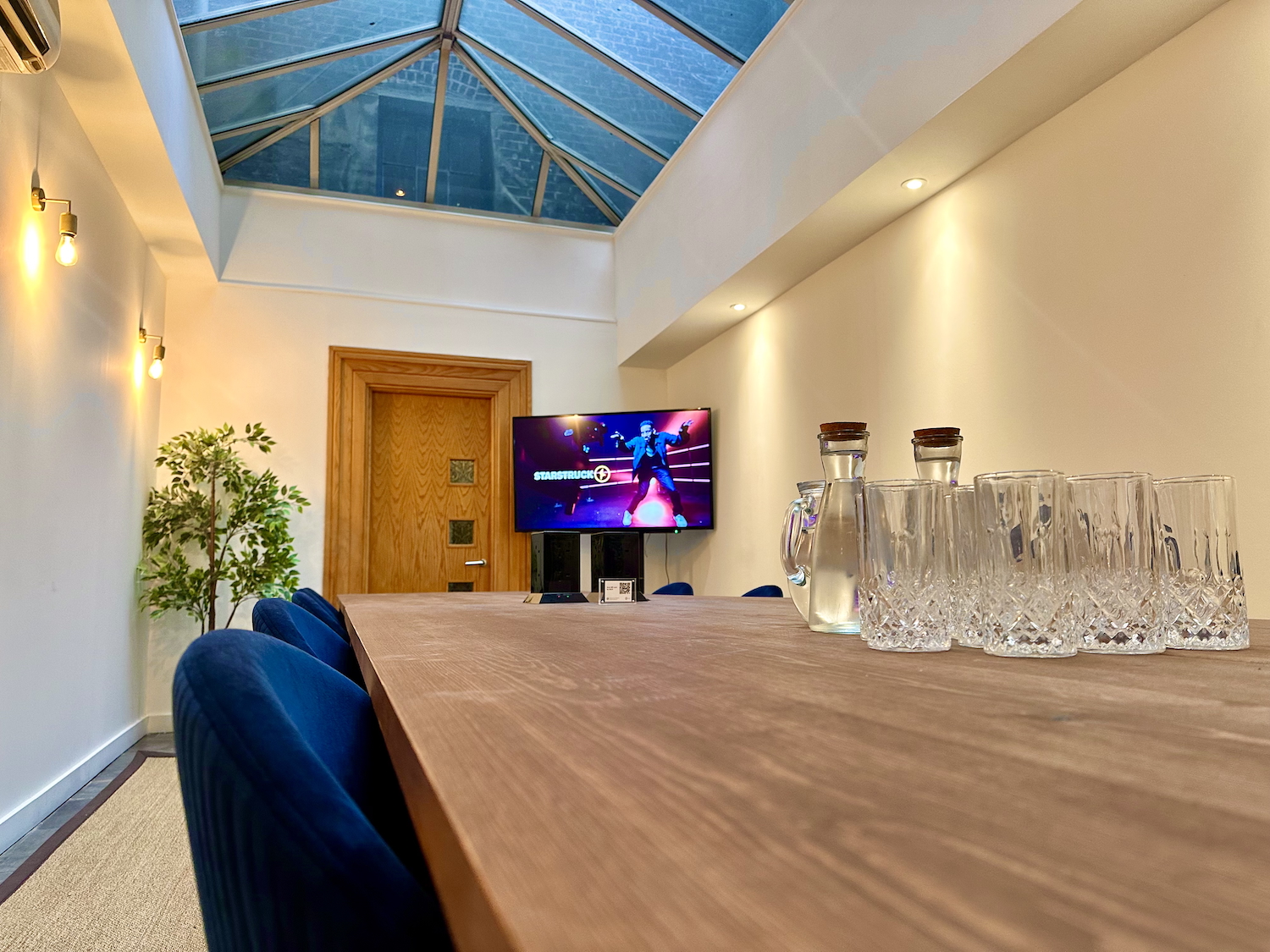 Modern meeting space in Starstruck HQ with skylight, ideal for collaborative events.