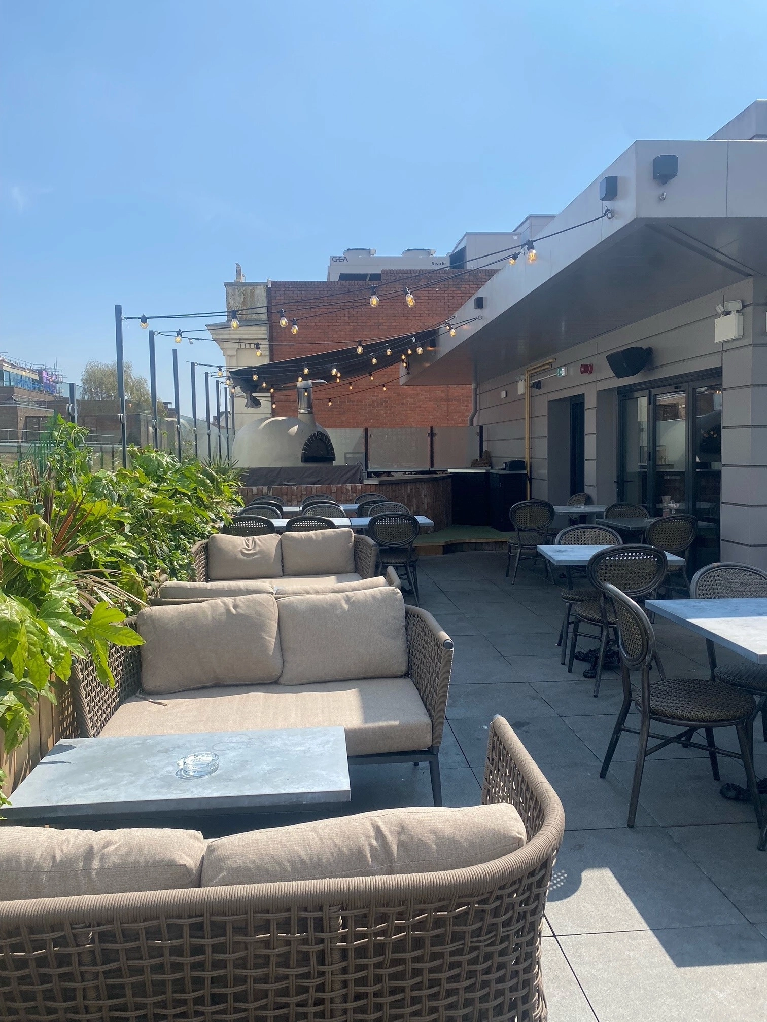 Stylish outdoor venue with lounge seating at The Botanist Exeter for events and meetings.