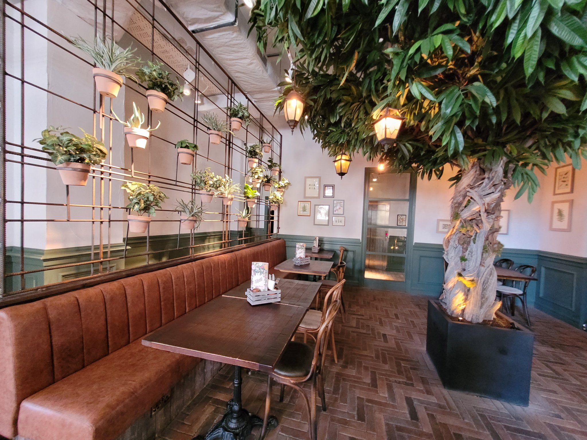 Stylish event space at The Botanist Exeter with lush greenery for intimate gatherings.