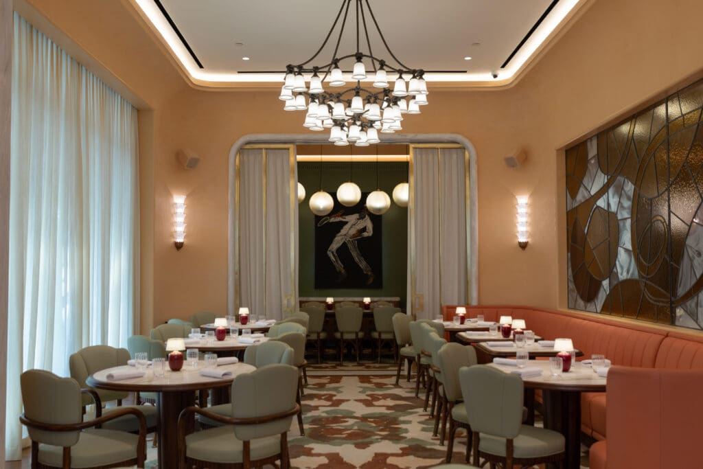 Elegant restaurant dining space with soft lighting, ideal for intimate events and meetings.