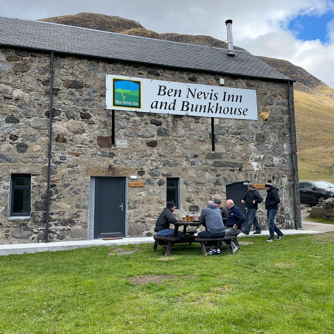 Ben Nevis Inn's Main Barn with rustic stone, perfect for outdoor events and team-building.