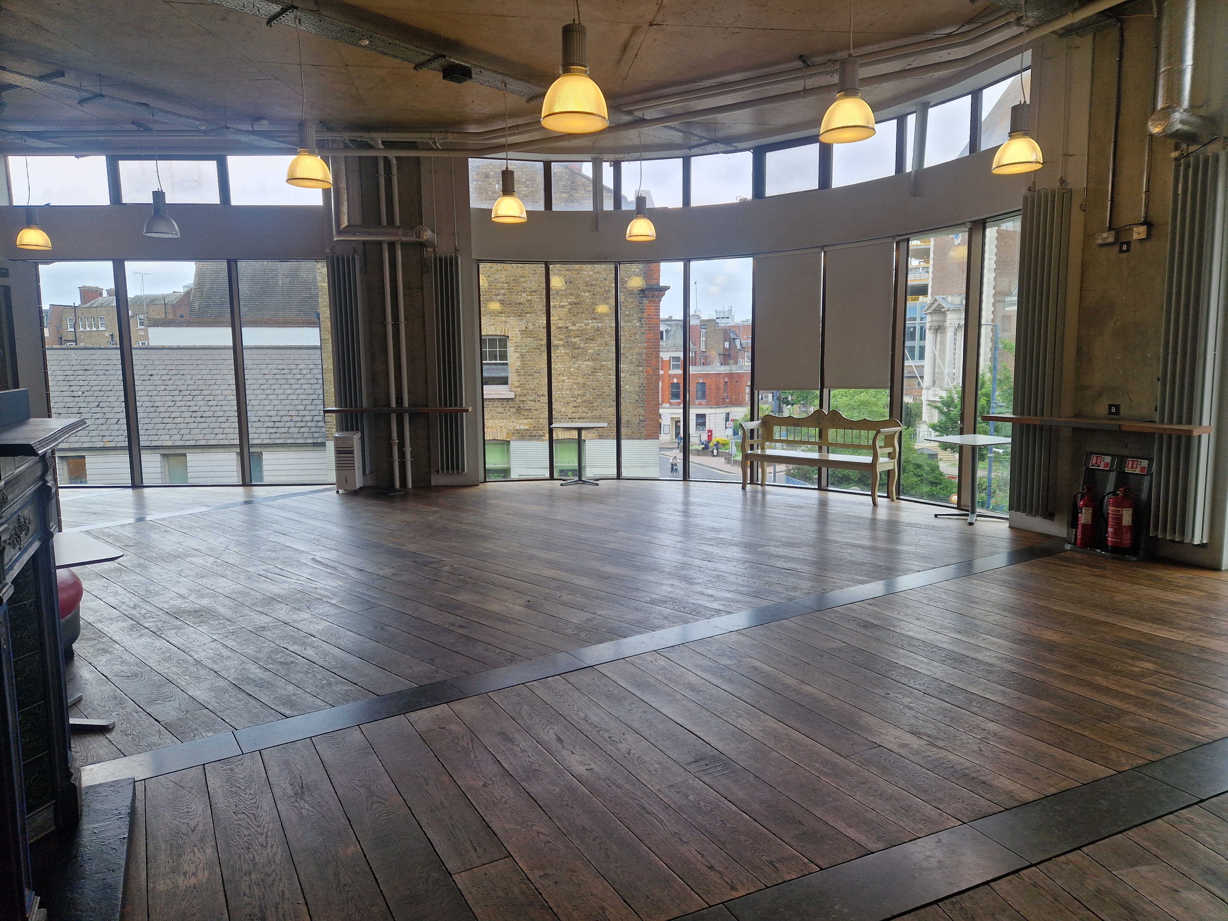 Spacious David Jacobs Room with large windows, perfect for meetings and workshops.