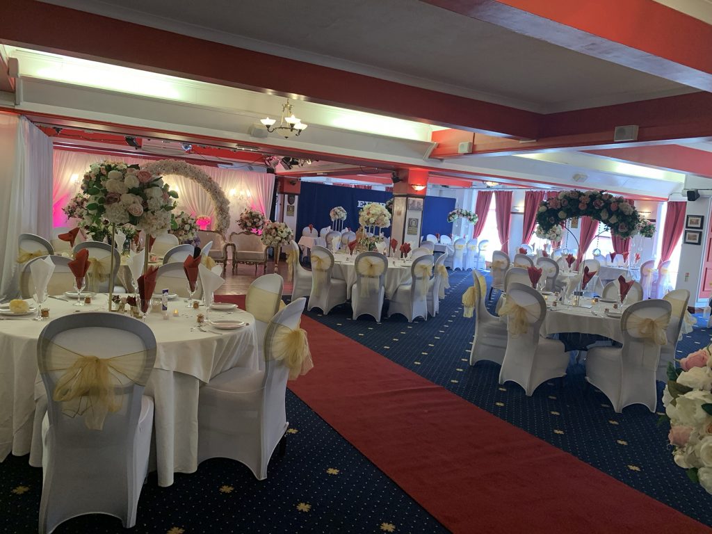 Main Hall with round tables, elegant decor for weddings and formal events.