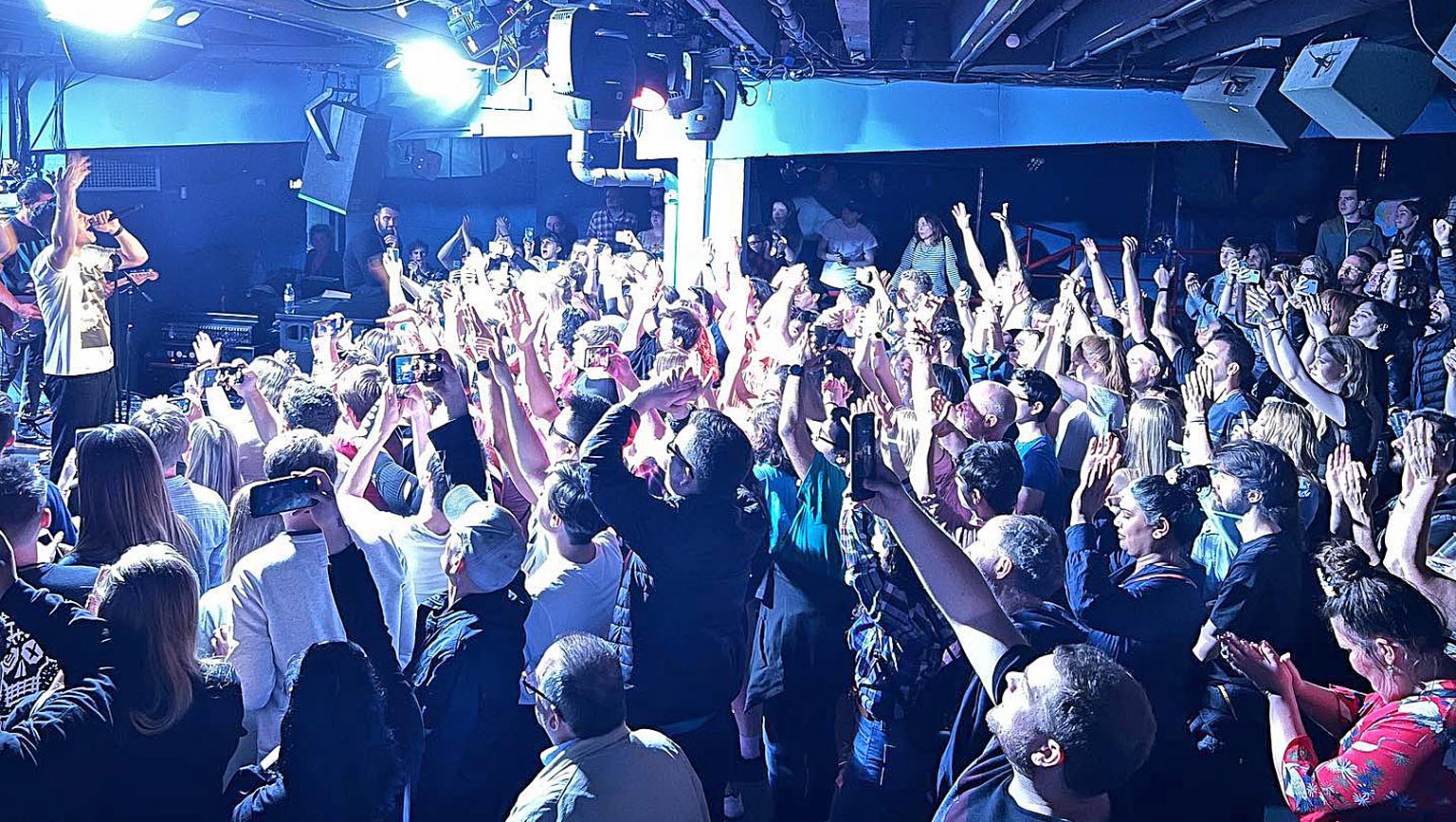 Main Hall T.E Dingwall Building, vibrant event with engaged audience and energetic ambiance.