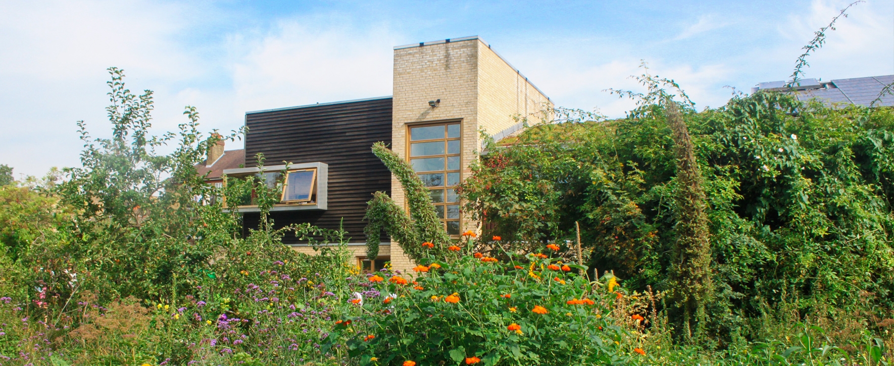 Main Hall & Gardens venue with modern architecture, ideal for outdoor events and gatherings.