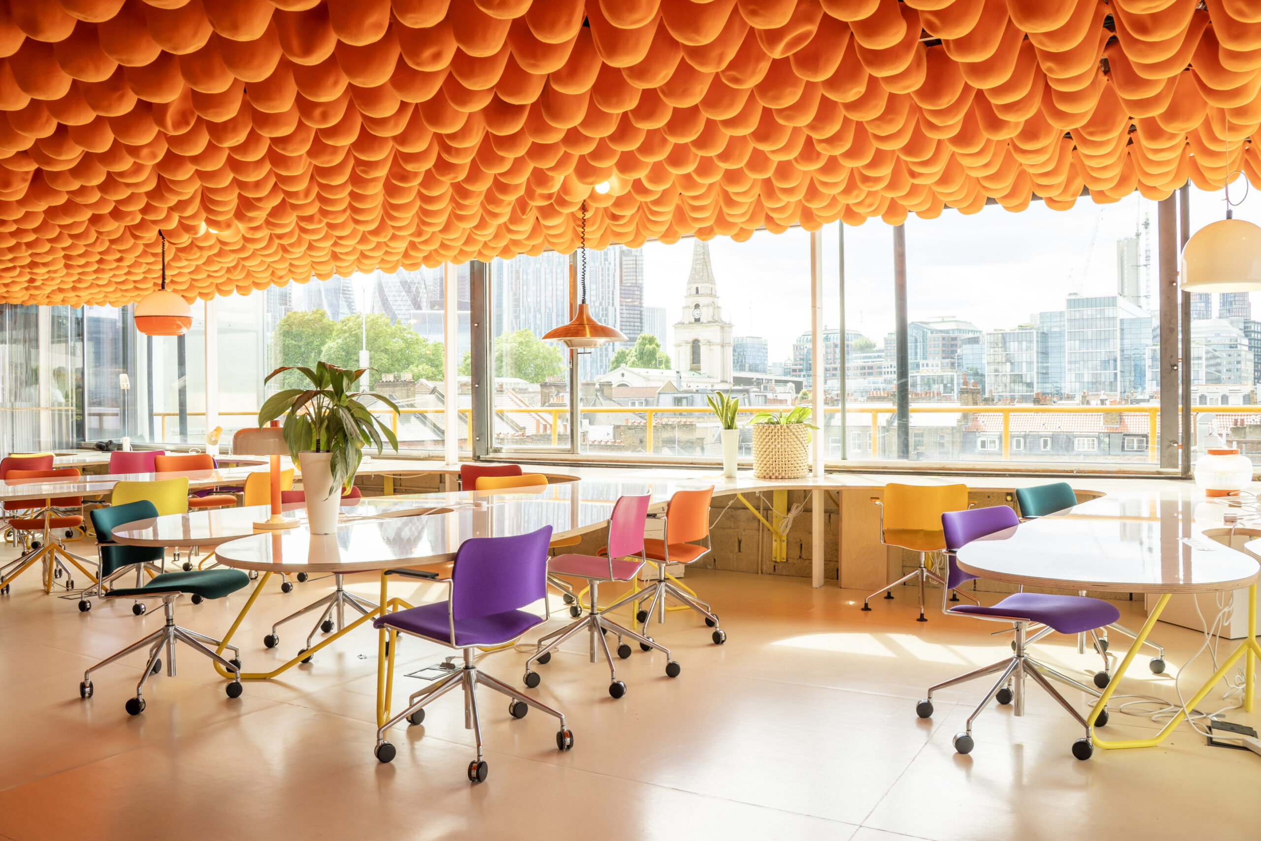 Modern workshop space with orange sphere ceiling design at Second Home Spitalfields.