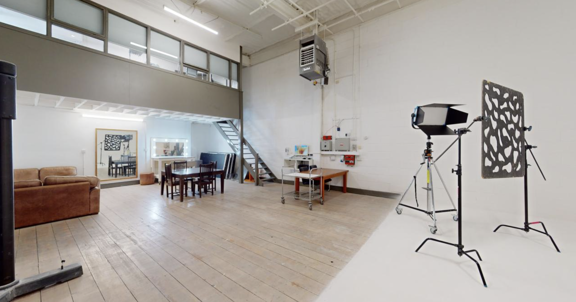Versatile industrial event space in Holborn Studios with natural light for workshops and gatherings.