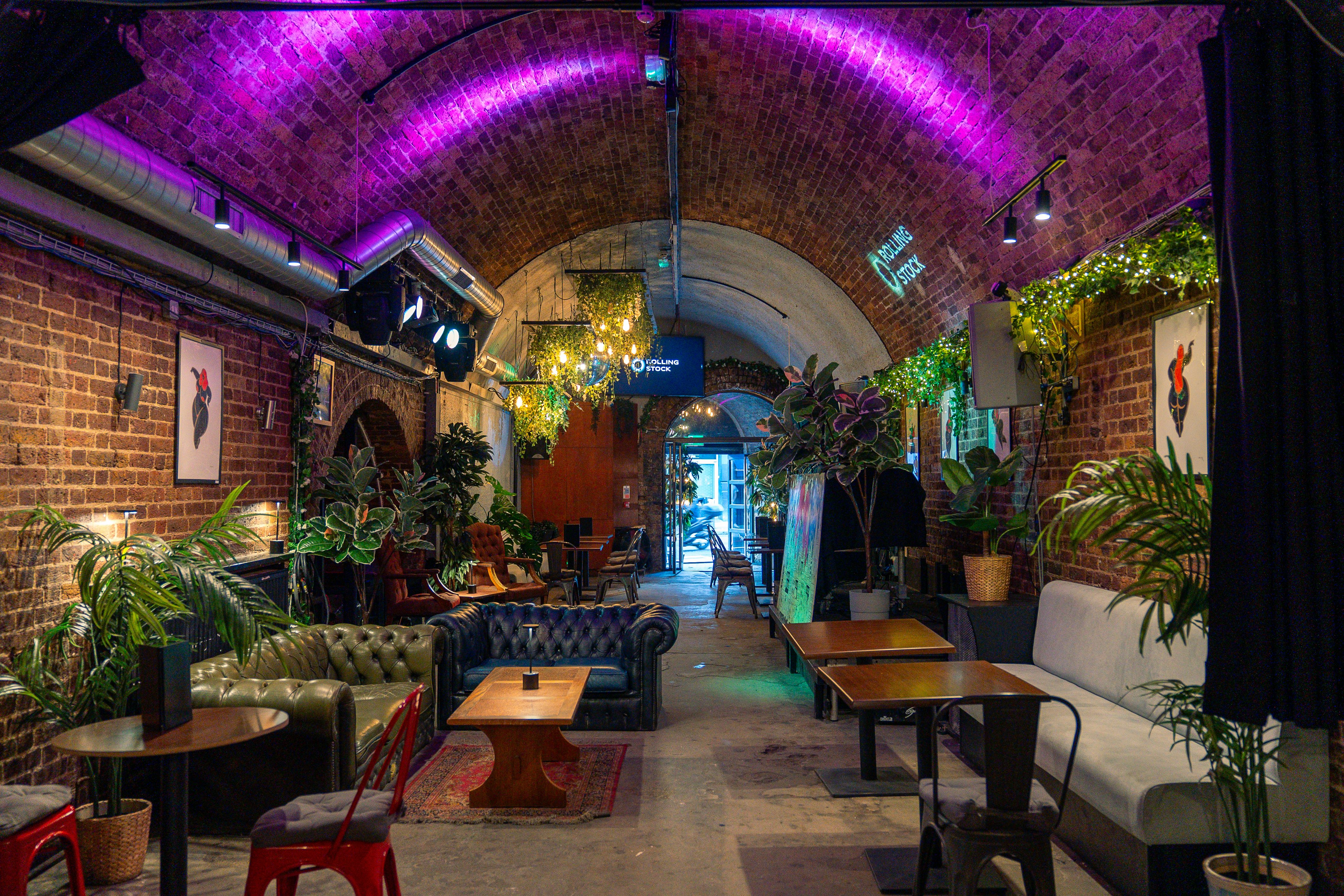 Garden + Main Arch venue in London with exposed brick, ideal for casual meetings and events.