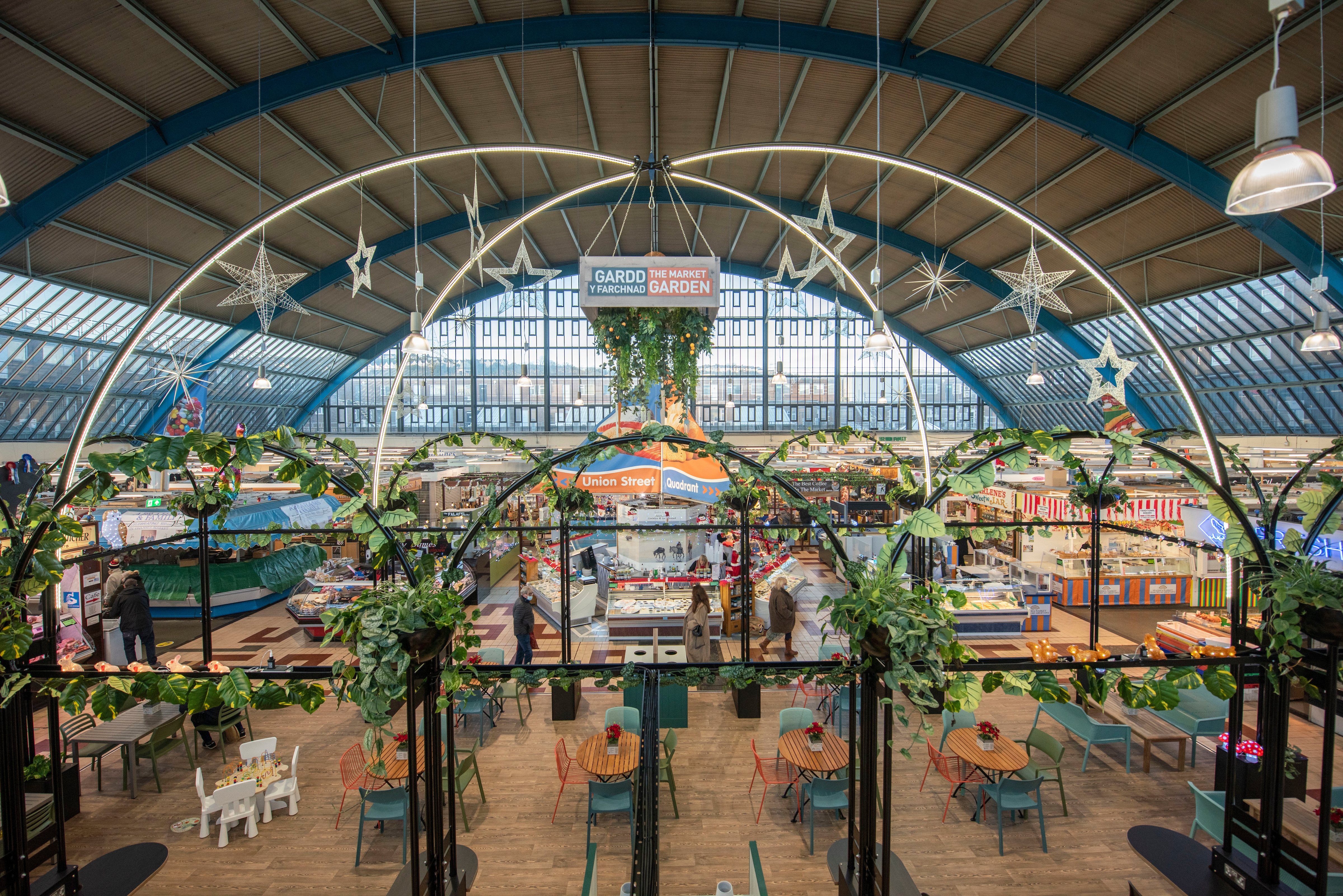 Vibrant event space with natural light in Swansea Indoor Market for networking and gatherings.