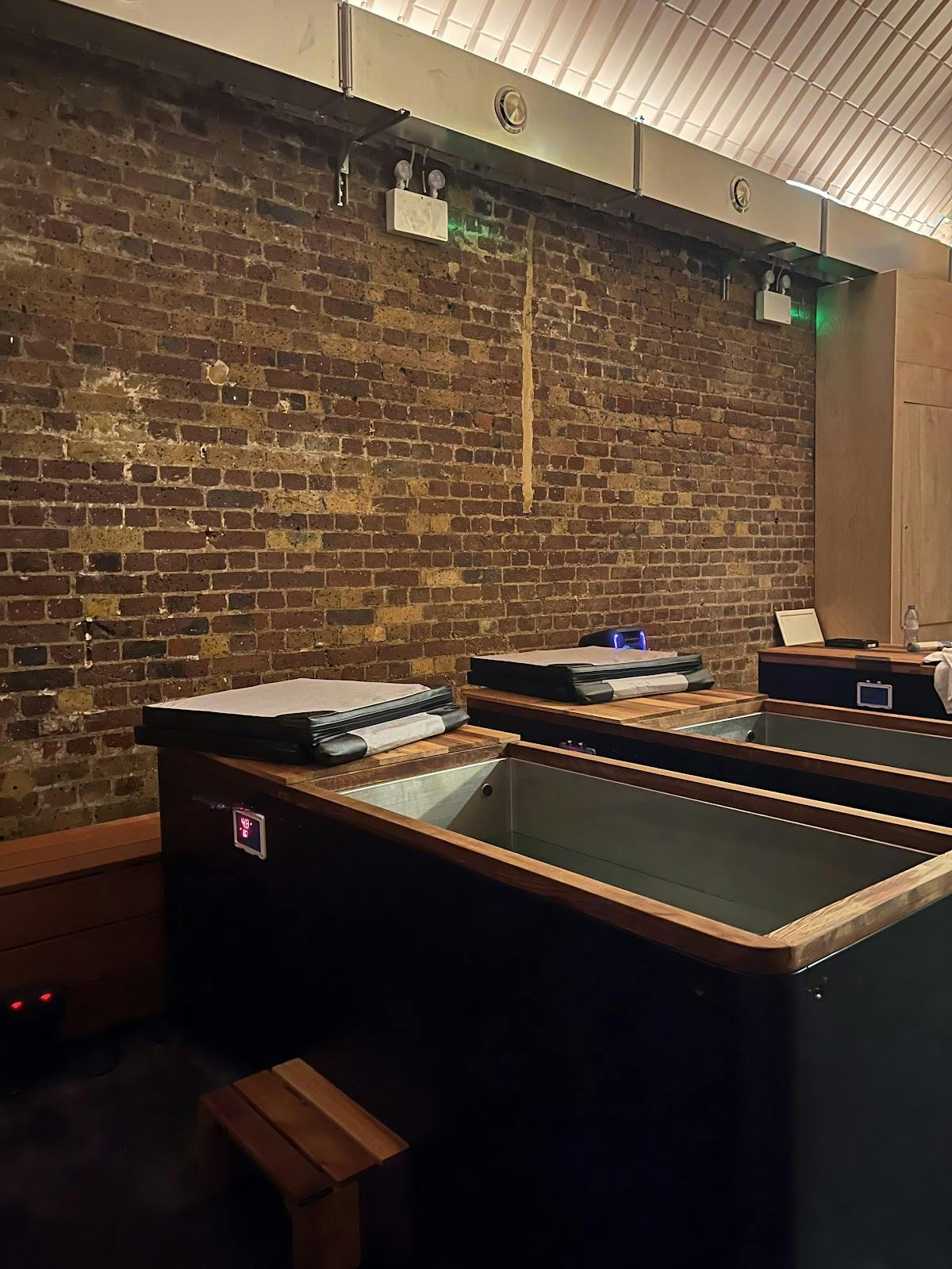 Wellness Centre at WellNest: rustic brick walls for workshops and gatherings.