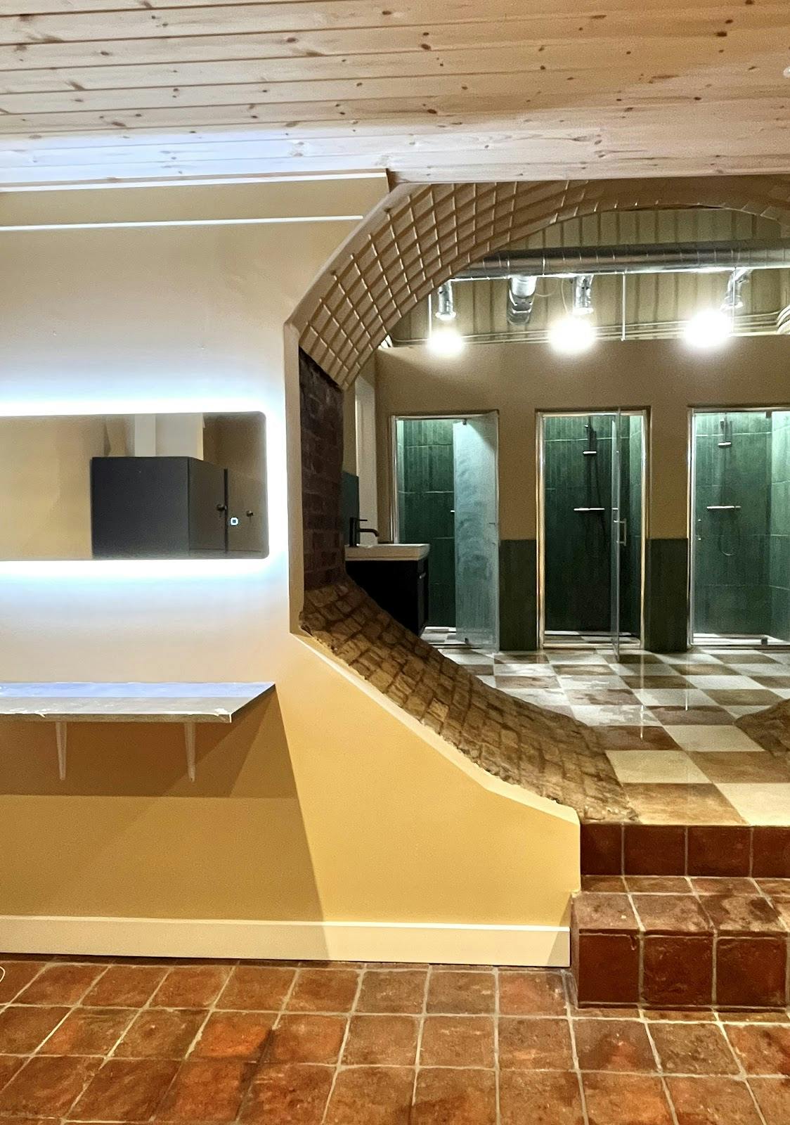 Modern Wellness Centre restroom with sleek finishes, ideal for upscale events and gatherings.