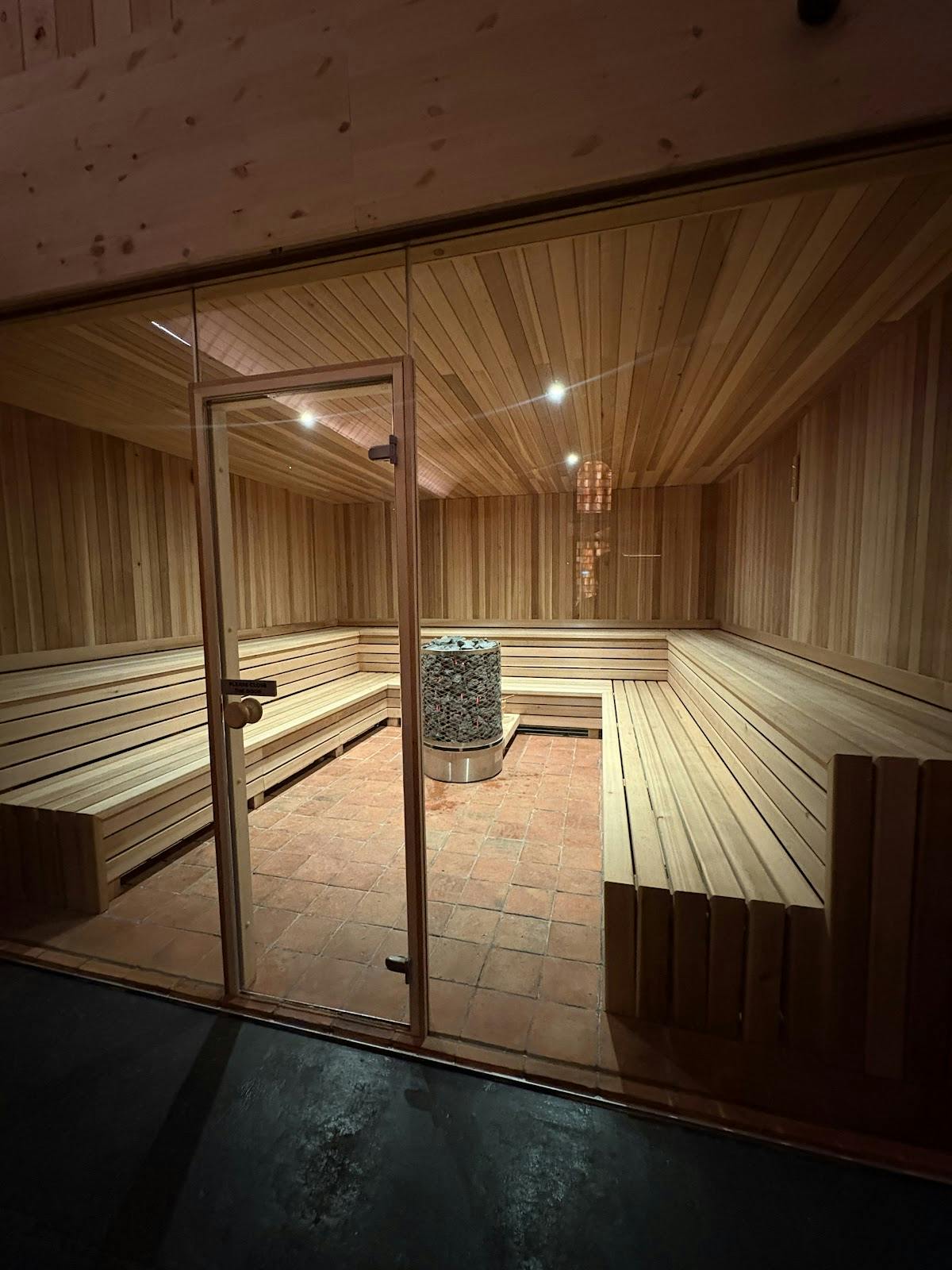 Modern sauna interior at WellNest Wellness Centre for retreats and corporate events.