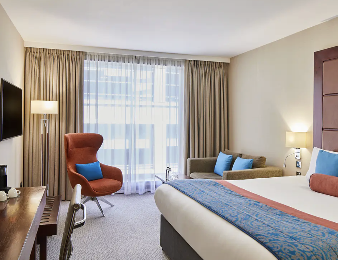 "Modern hotel room at Leonardo Royal Hotel London St. Paul's for business and leisure travel."