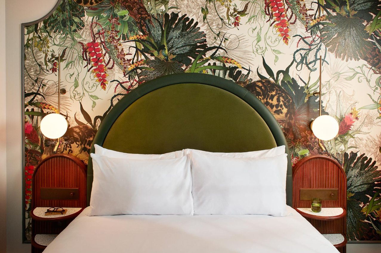 Stylish hotel room with botanical wallpaper, ideal for retreats and meetings in London.