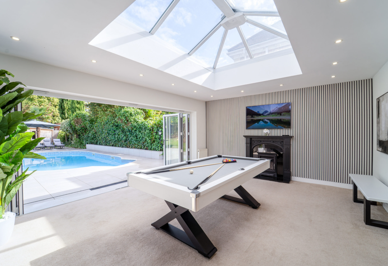 Modern games room at Emerson Park Villa, featuring a sleek pool table, perfect for retreats.