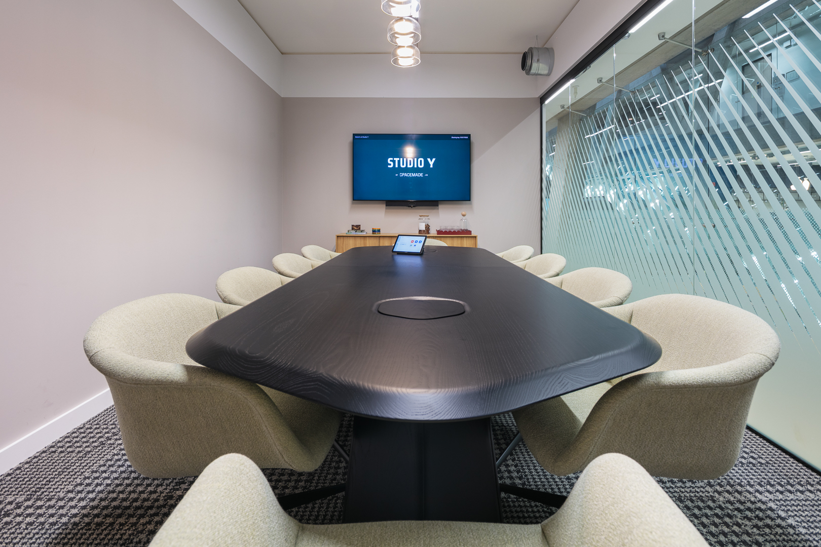 Modern Sketch boardroom with AV tech for hybrid meetings and professional corporate workshops.